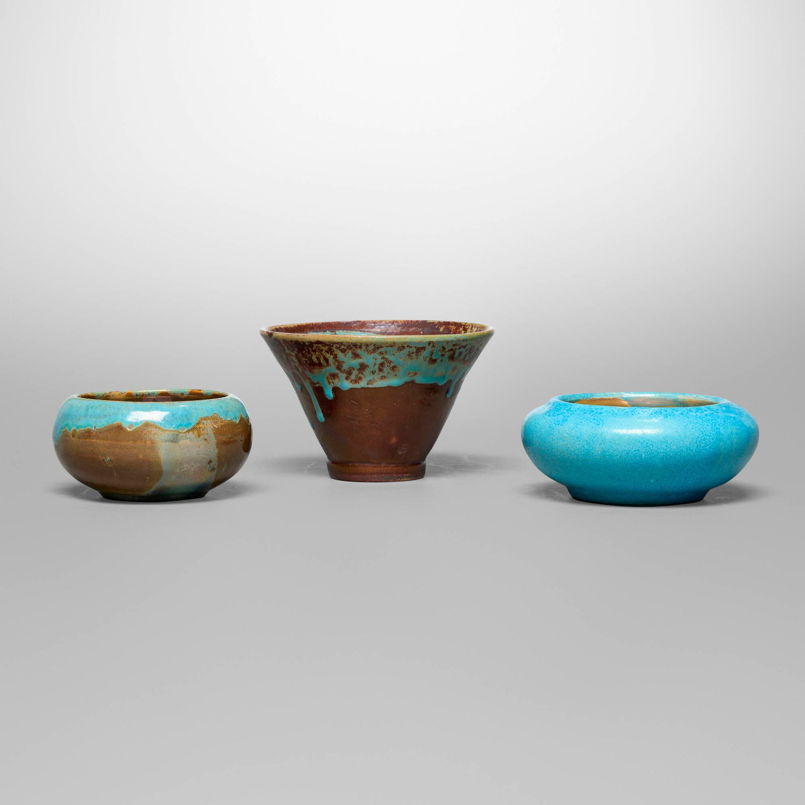 Pewabic Pottery, Collection of three vessels: Pewabic Pottery Collection of three vessels USA, c. 1915-30 iridescent-glazed earthenware 3.5 h x 5.25 dia in (9 x 13 cm) 2.25 h x 5 dia in (6 x 13 cm) 2.25 h x 4.25 dia in (6 x 11 cm) Collection is