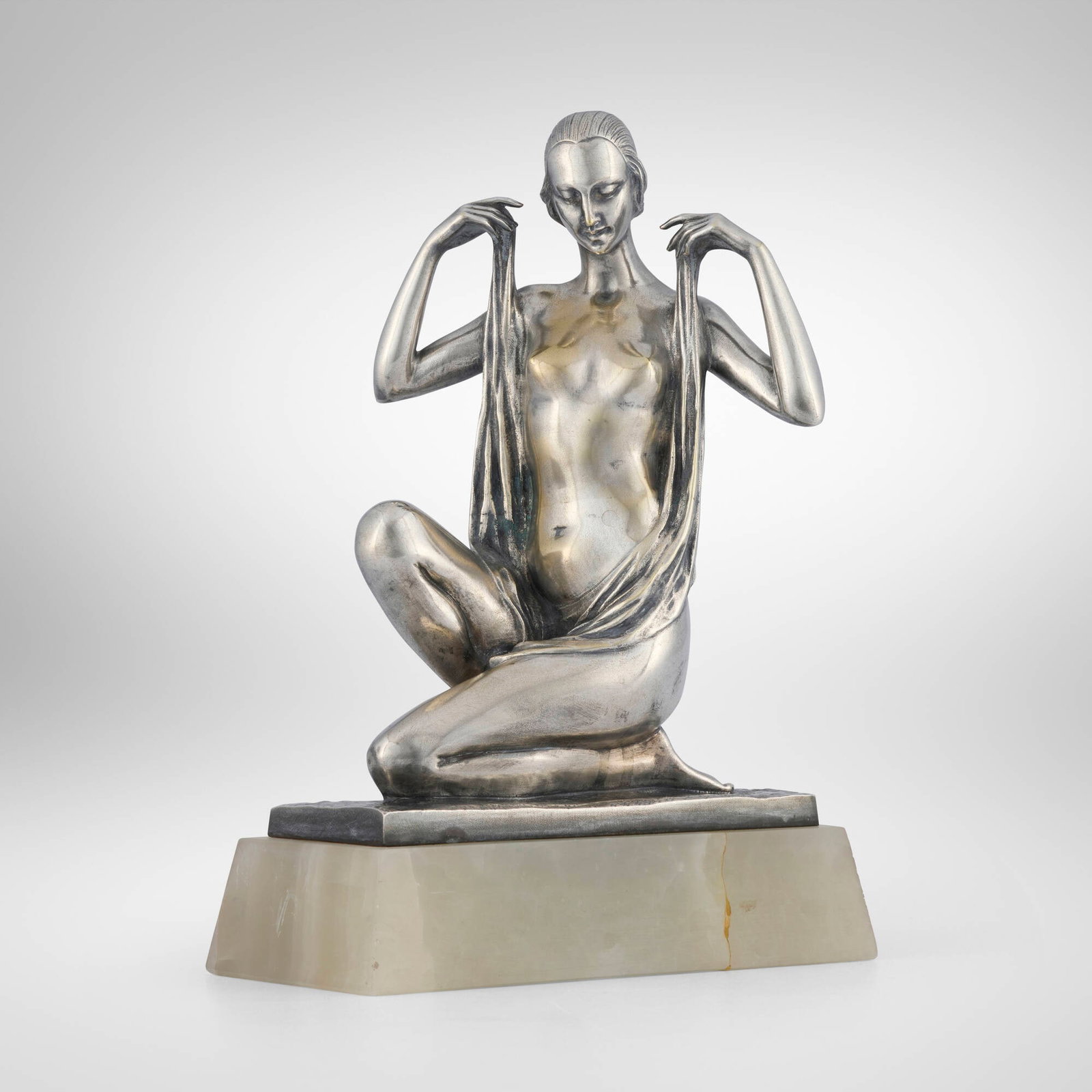 Henri Fugere, Sculpture of a nude woman: Henri Fugere Sculpture of a nude woman c. 1925 silvered bronze, white onyx 12.875 h x 9 w x 5.625 d in (33 x 23 x 14 cm) Incised signature to base 'H. Fugere' with impressed foundry mark to 