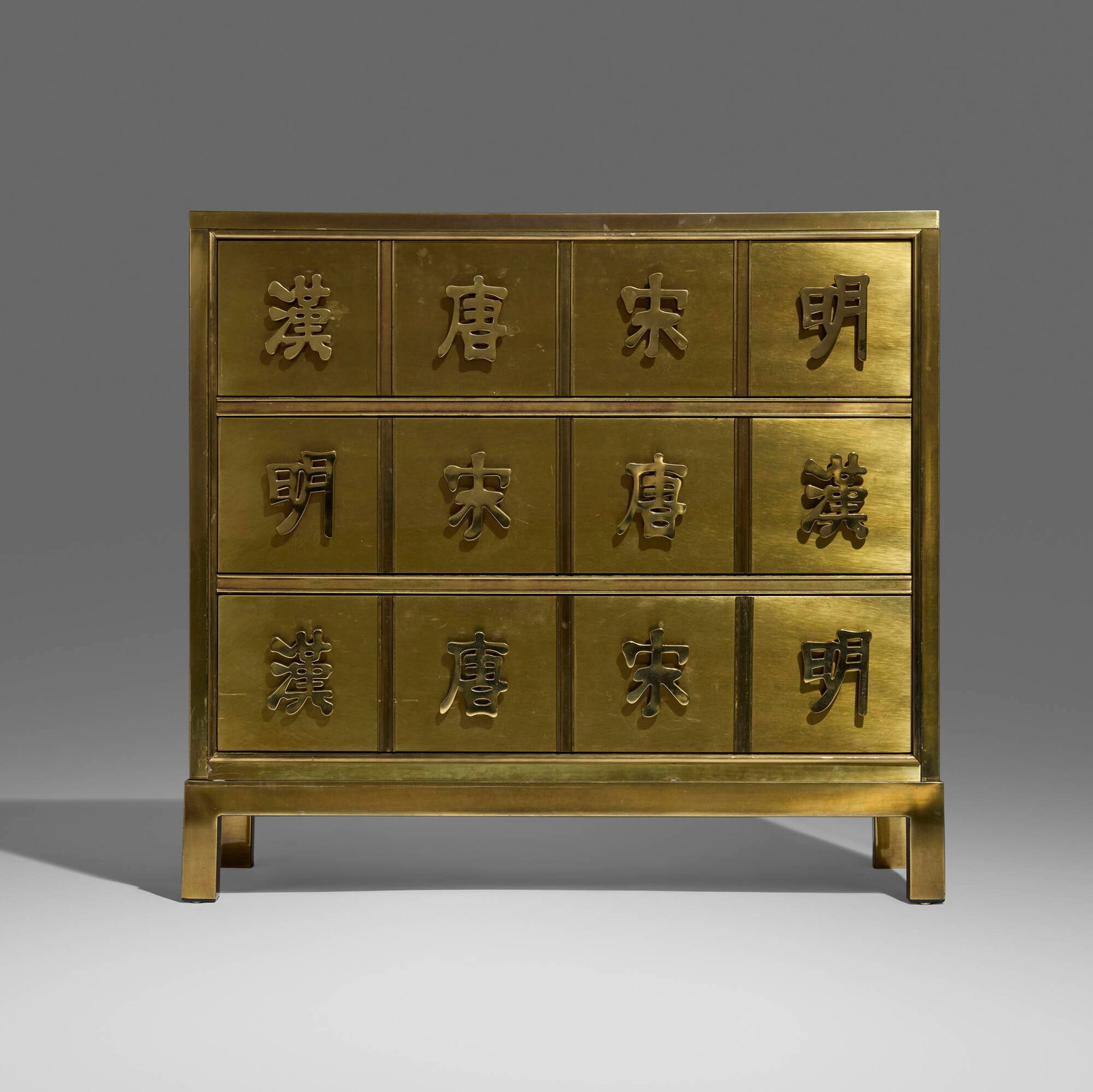 Mastercraft, Chest of drawers: Mastercraft Chest of drawers USA, c. 1975 brass over wood 29.5 h x 31.75 w x 16 d in (75 x 81 x 41 cm) Chest features three drawers, each featuring four pulls representing Chinese Dynasties: Han, Song