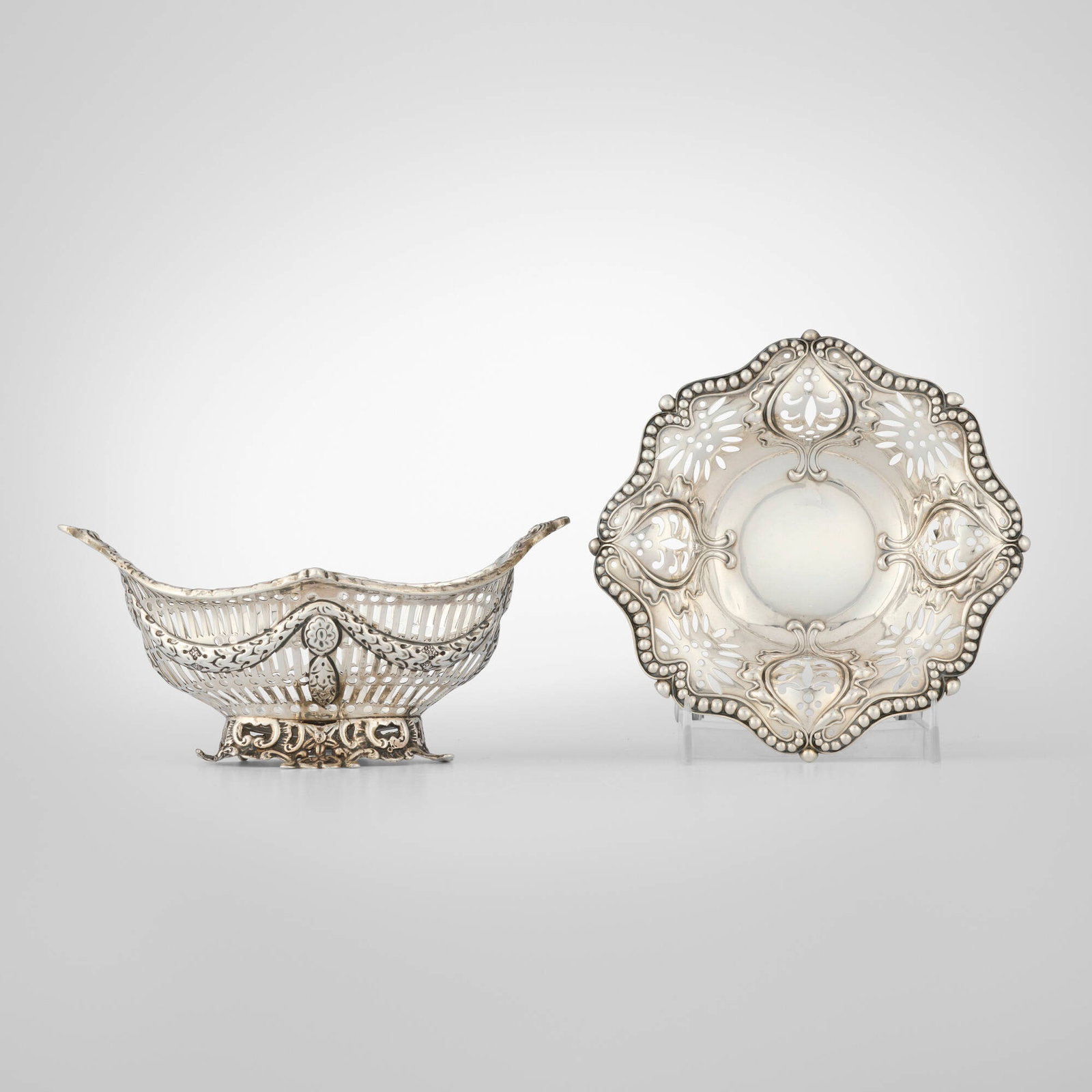 American and English, Sweetmeat dishes with pierced decoration, set of two: American and English Sweetmeat dishes with pierced decoration, set of two c. 1895, 1896 sterling silver, silver 3.25 h x 7 w x 4.5 d in (8 x 18 x 11 cm) 5.75 dia in (15 cm) Lot is comprised of an
