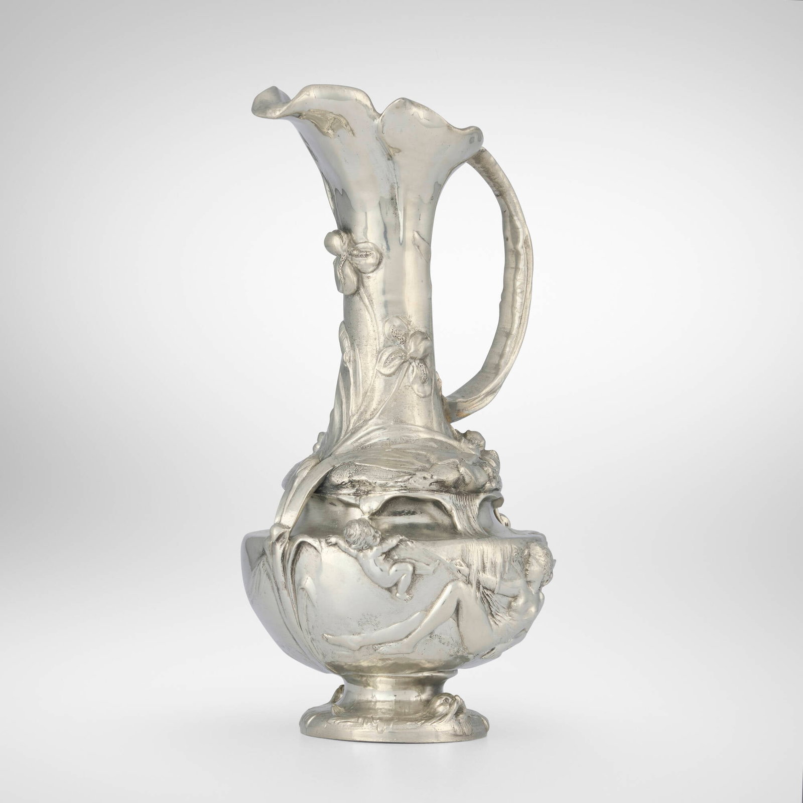 Jean-Maurice Petizon, Art Nouveau figural ewer: Jean-Maurice Petizon Art Nouveau figural ewer France, c. 1900 pewter 13.25 h x 7 w x 6.5 d in (34 x 18 x 17 cm) Ewer features a nymph, putti, flowers and leaves. Impressed manufacturer's mark to