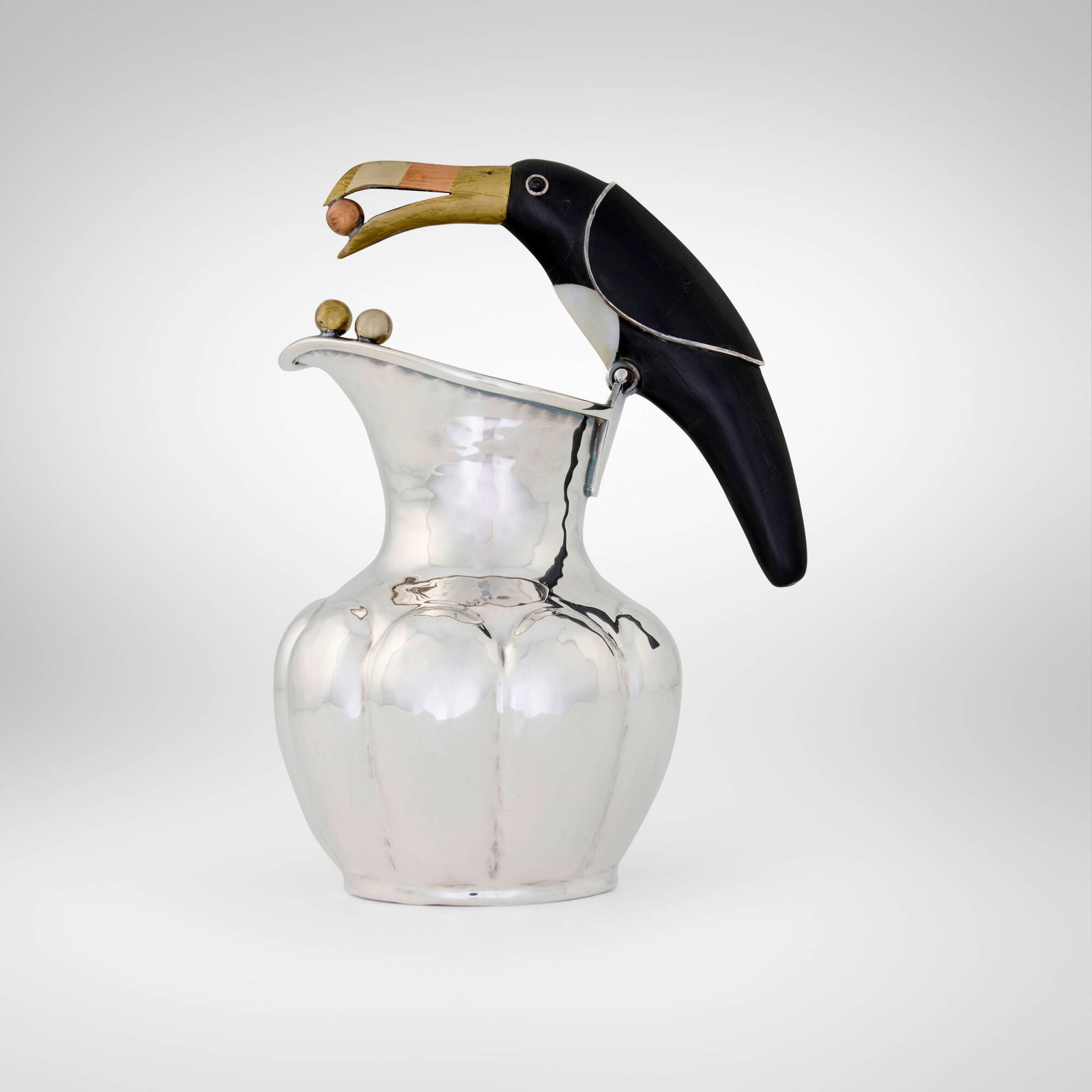 Los Castillo, Pitcher with toucan handle: Los Castillo Pitcher with toucan handle Mexico, c. 1985 silver-plated brass, brass, copper, black stone, mother-of-pearl 8.25 h x 6 w x 4.5 d in (21 x 15 x 11 cm) Impressed manufacturer's mark to