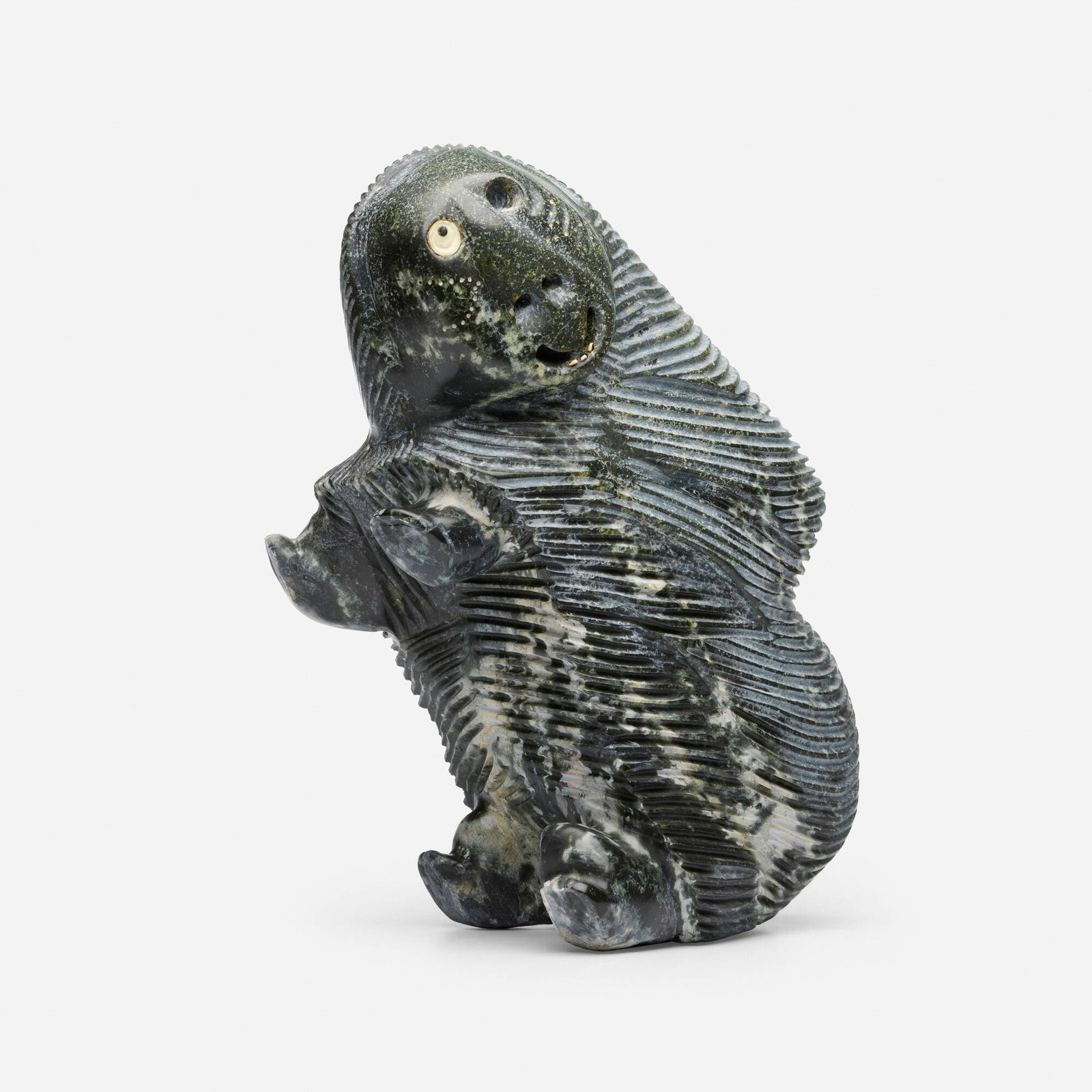 Judas Ullulaq, Muskox (Inuit sculpture): Judas Ullulaq Muskox (Inuit sculpture) serpentine 15.75 h x 12 w x 8 d in (40 x 30 x 20 cm) Incised syllabic signature to underside with sticker labels 'Carving Number 9521 118' and