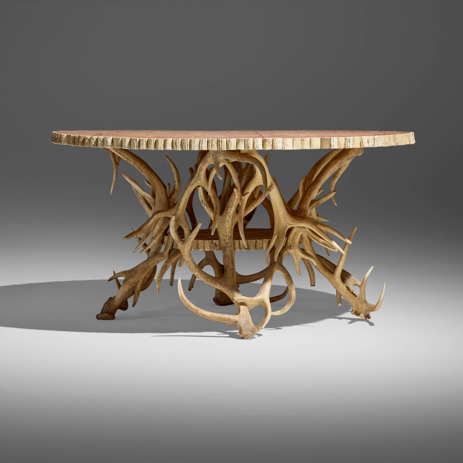Rustic, Center table: Rustic Center table 20th century antlers, pine 29 h x 54 dia in (74 x 137 cm) This work will ship from Los Angeles, California.