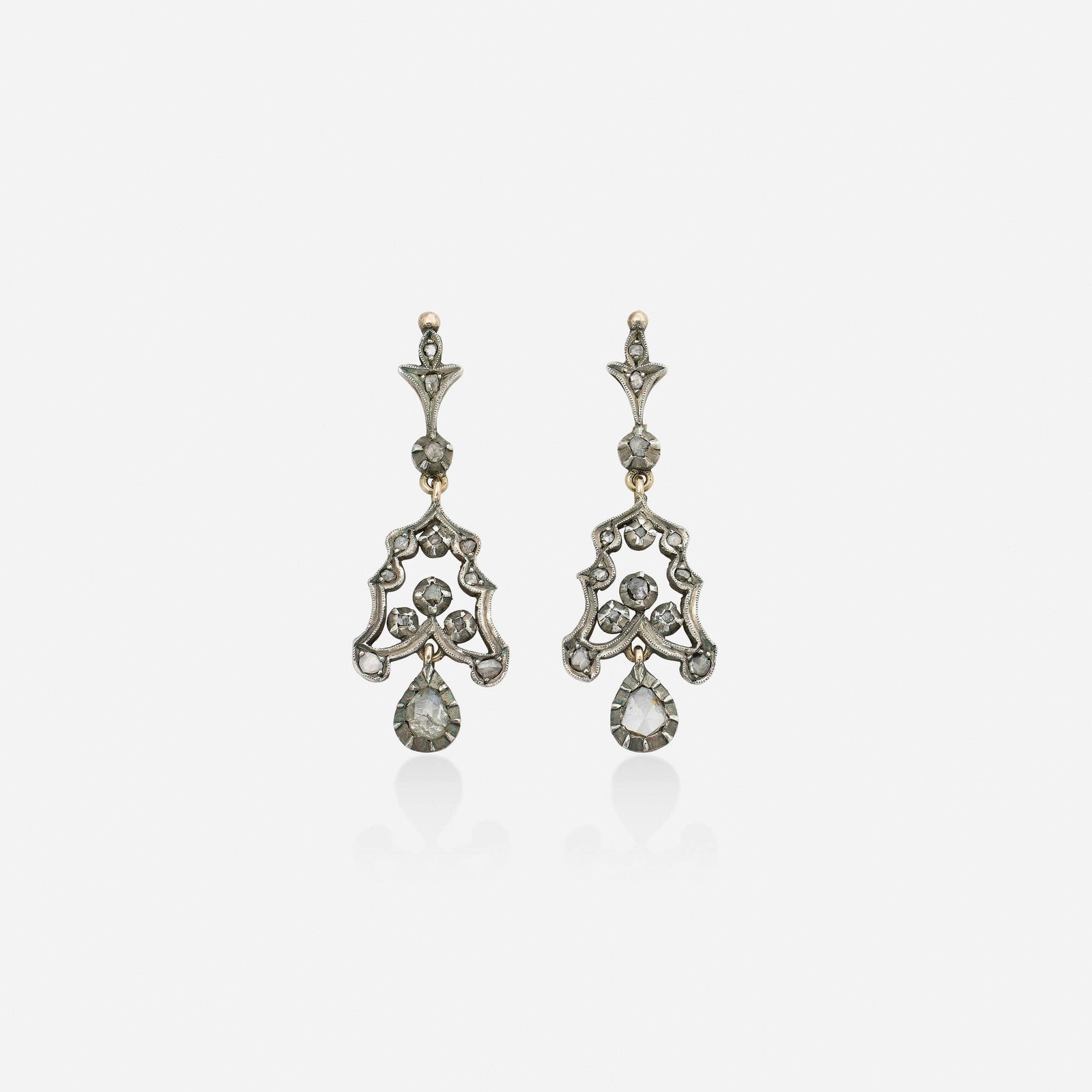 Antique, Diamond and silver-topped pink gold earrings: Antique Diamond and silver-topped pink gold earrings Each of chandelier design, set with rose-cut diamonds Silver-topped low karat pink gold 1.75 x 0.625 in; Gross weight 3.6 dwts This work will ship 