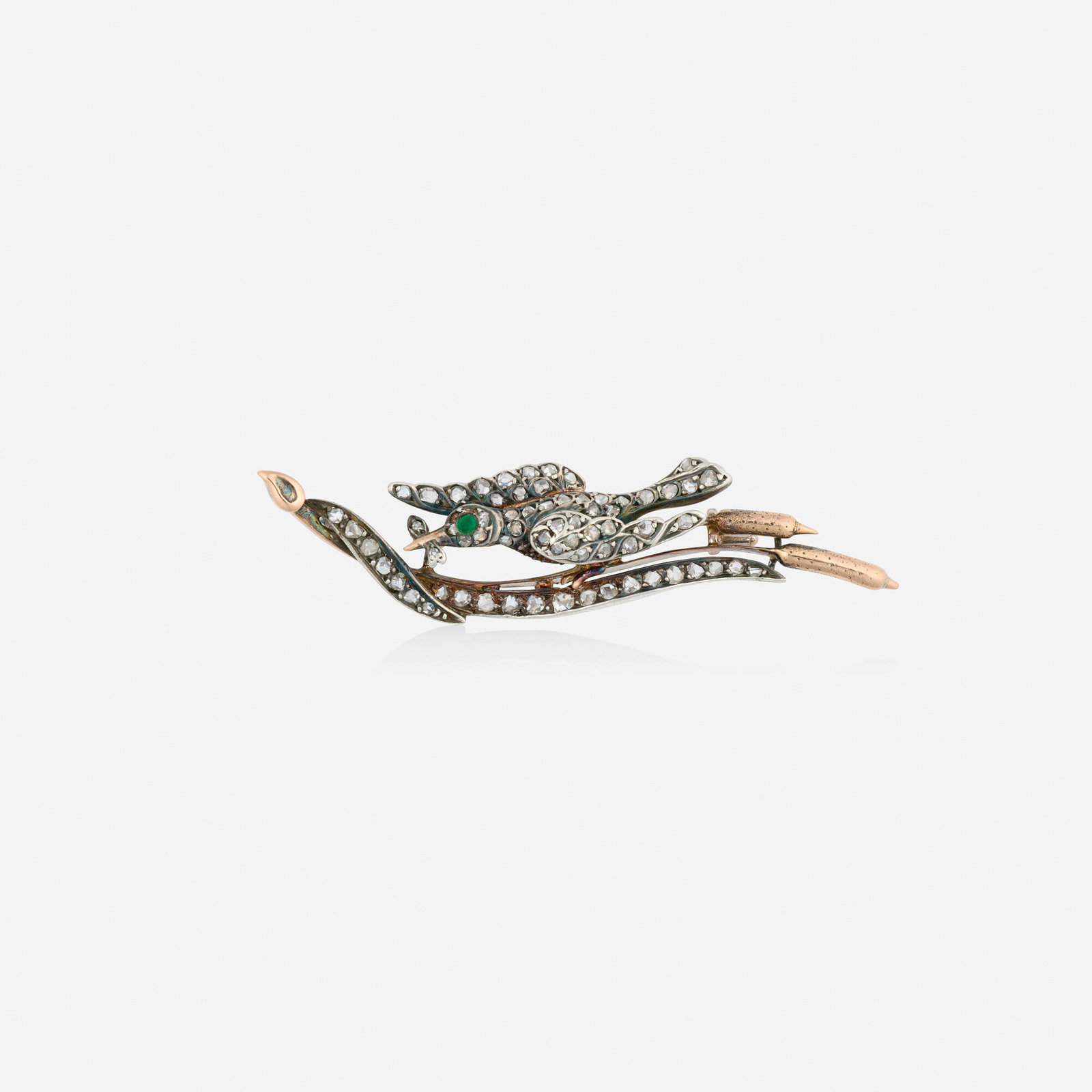 Victorian, Diamond, emerald, and silver-topped pink gold pendant brooch: Victorian Diamond, emerald, and silver-topped pink gold pendant brooch Designed with a bird catching a fish while perched on cattails, set with rose-cut diamonds and a circular-cut emerald Silver-topp
