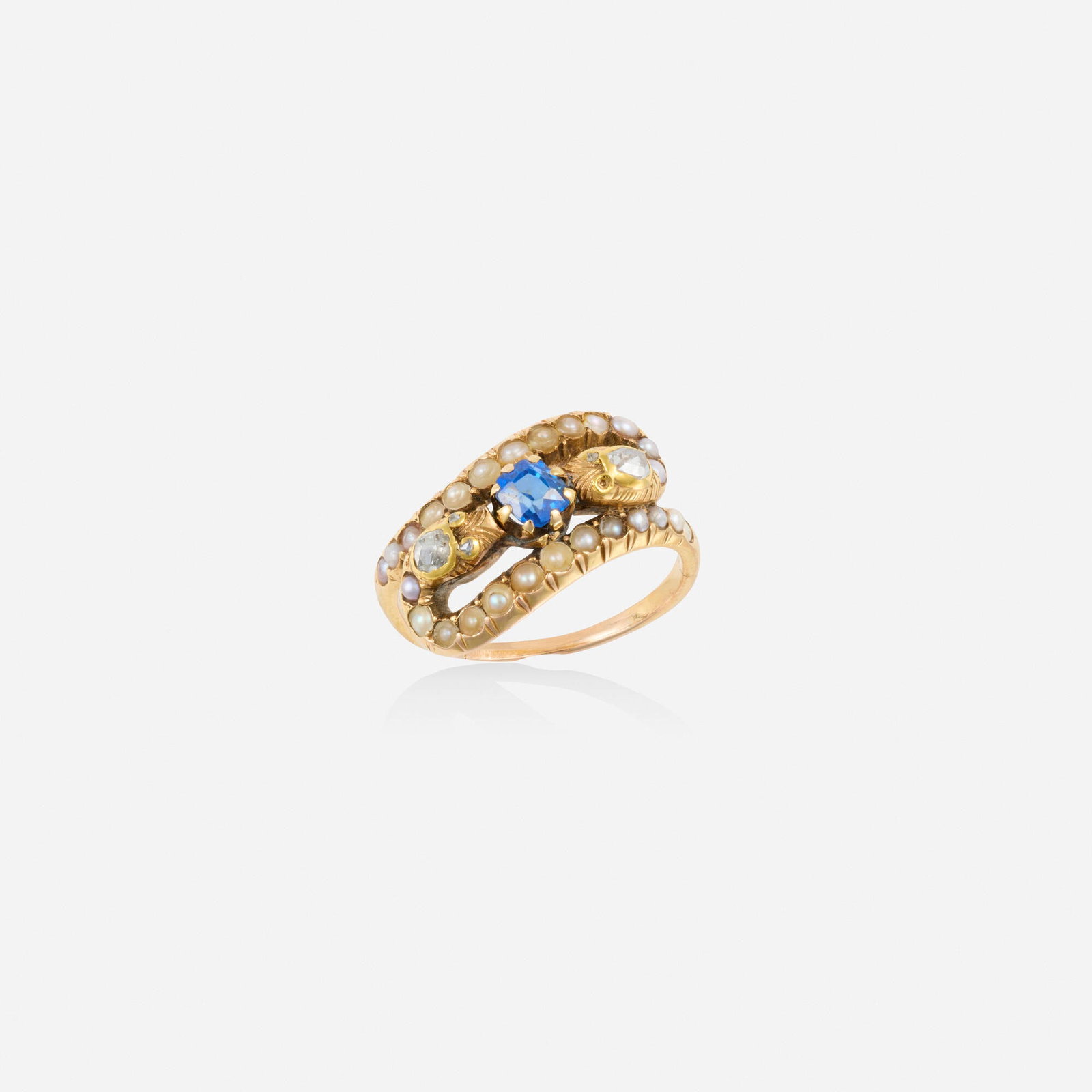Antique, Sapphire, seed pearl, and gold ring: Antique Sapphire, seed pearl, and gold ring Designed with two snakes set with a cushion-cut sapphire, rose-cut diamonds and seed pearls 18k yellow gold Ring size 5.25; Gross weight 2.3 dwts This work 