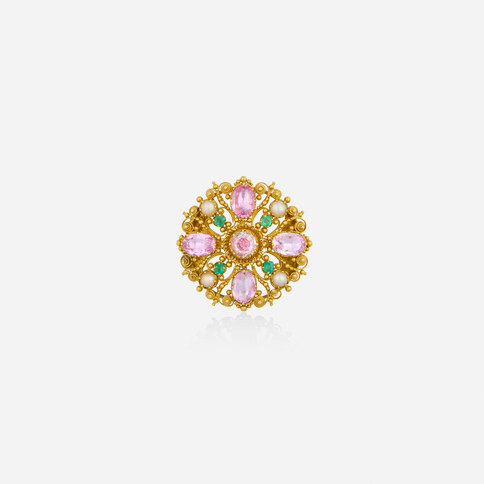 Antique, Multi-gem and gold brooch: Antique Multi-gem and gold brooch Of cannetille design, set with oval-cut foil-back pink topaz, cushion-cut emeralds, and mabe pearls Yellow gold 2.125 in; Gross weight 5.2 dwts Sold with fitted box T