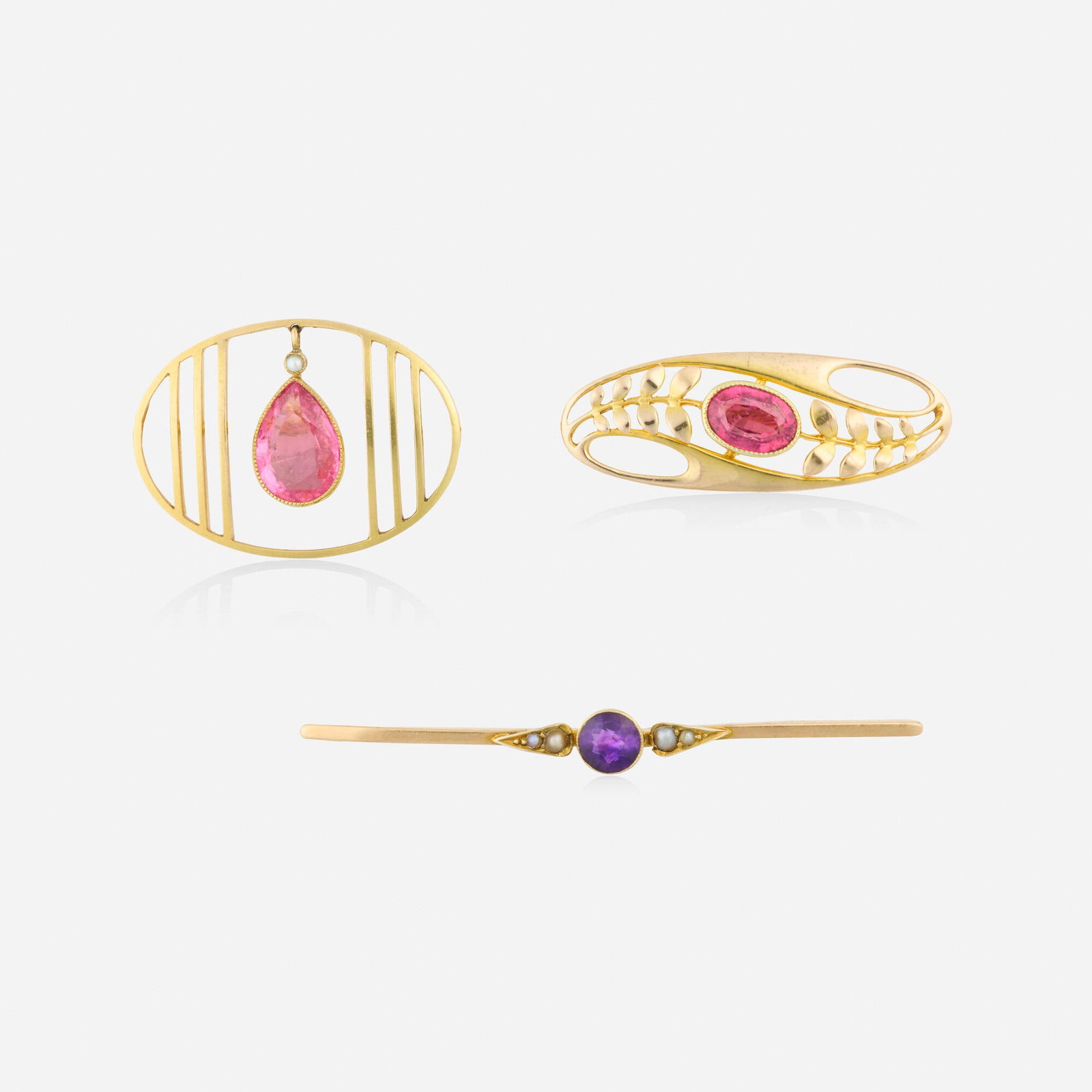 Murrle, Bennett & Co. and Barnet Henry Joseph, Three Art Nouveau multi-gem and gold brooches: Murrle, Bennett & Co. and Barnet Henry Joseph Three Art Nouveau multi-gem and gold brooches Comprising one brooch set with an oval-cut pink tourmaline and one brooch set with circular-cut amethyst and