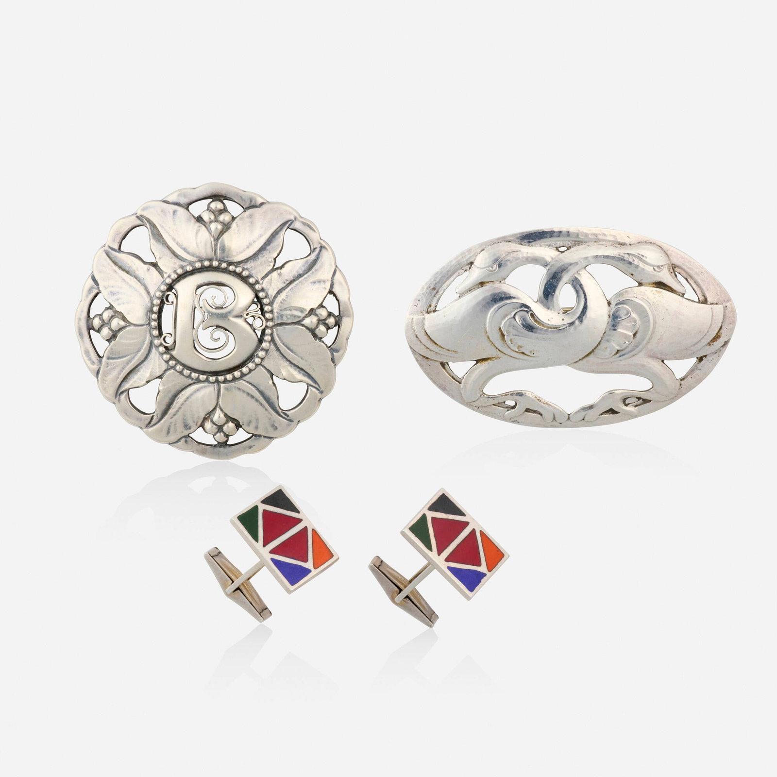 Chicago School Arts & Crafts, Group of sterling silver jewelry: Chicago School Arts & Crafts Group of sterling silver jewelry Comprising a pair of enamel cufflinks by Kalo, a swan brooch, no. 53 by Julius O. Randahl, and a foliate brooch with B monogram by Yngve O
