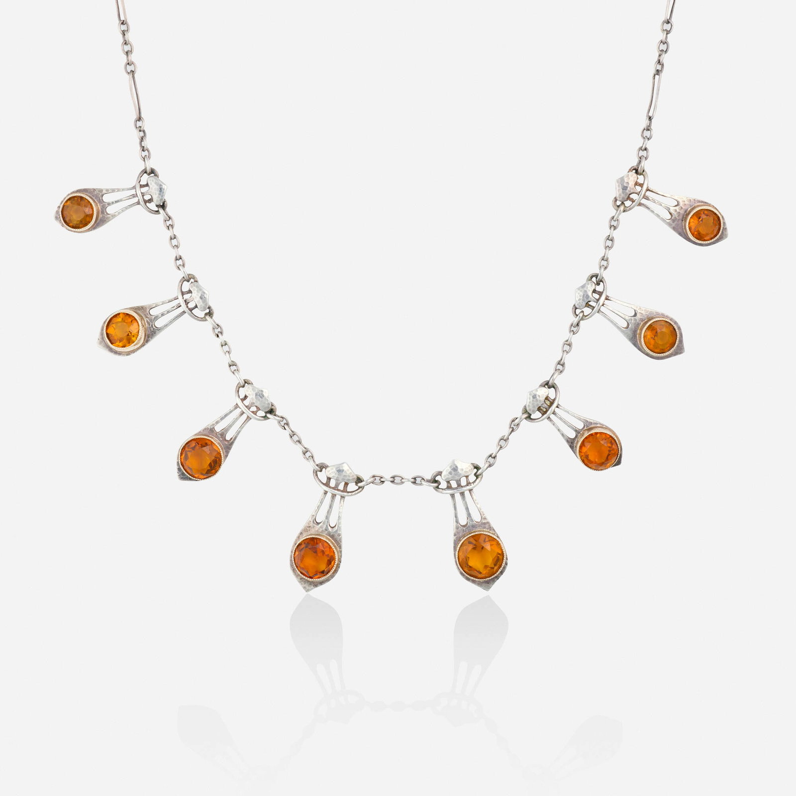 Murrle, Bennett & Co., Arts & Crafts citrine and silver necklace: Murrle, Bennett & Co. Arts & Crafts citrine and silver necklace Designed with eight graduated hammered pendants set with circular-cut citrine, joined by the fine-link chain Silver, pink gold Signed wi