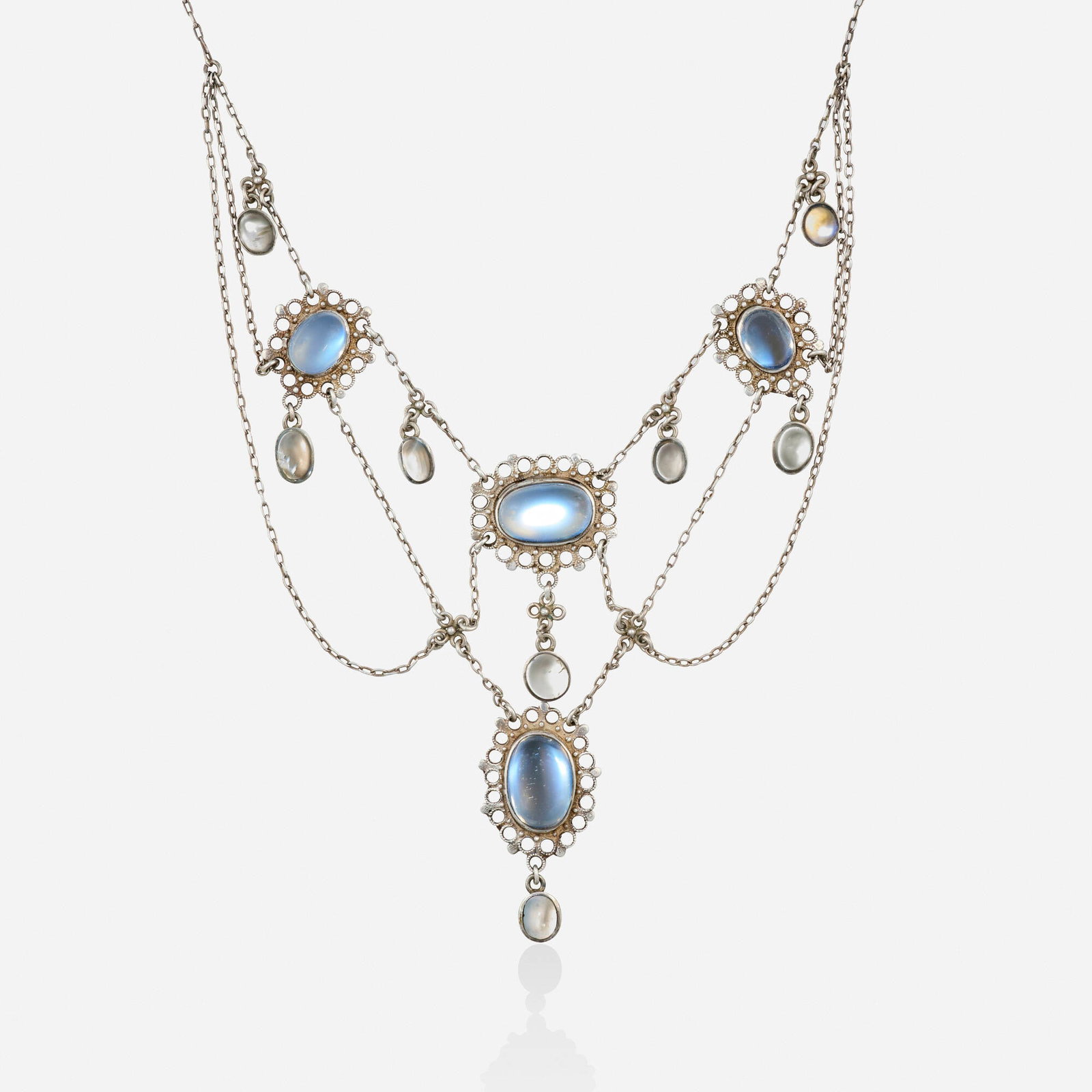 Liberty & Co., Art & Crafts moonstone and sterling silver necklace: Liberty & Co. Art & Crafts moonstone and sterling silver necklace Designed with swags of chain, suspending open-form pendants set with cabochon moonstones Sterling silver, 9k pink gold Signed with mak