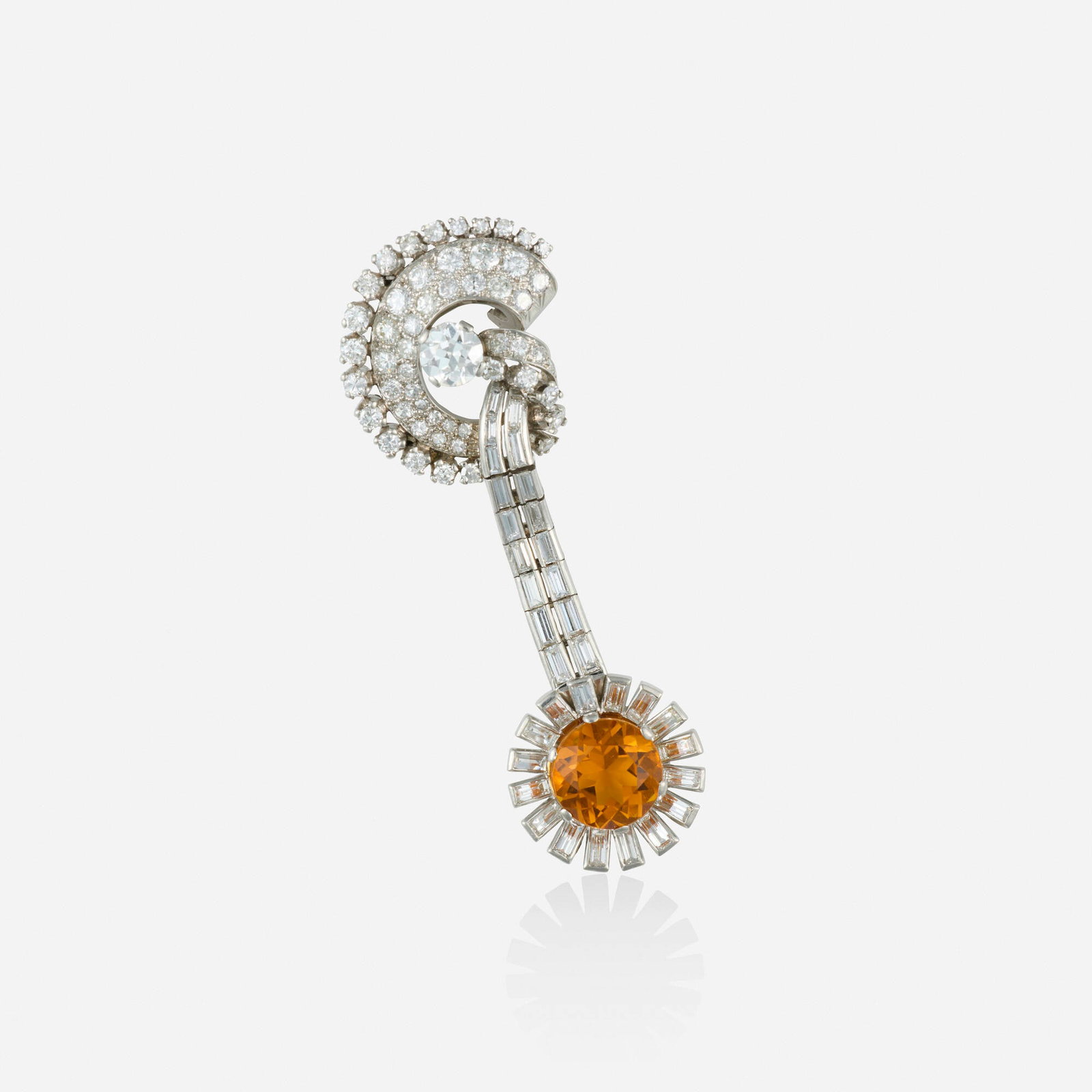 Art Deco, Citrine, diamond, and platinum brooch: Art Deco Citrine, diamond, and platinum brooch Of scrolling design, set with a circular-cut citrine, and old European, round brilliant, single, and baguette-cut diamonds Platinum 2.50 x 0.875 in; Gros