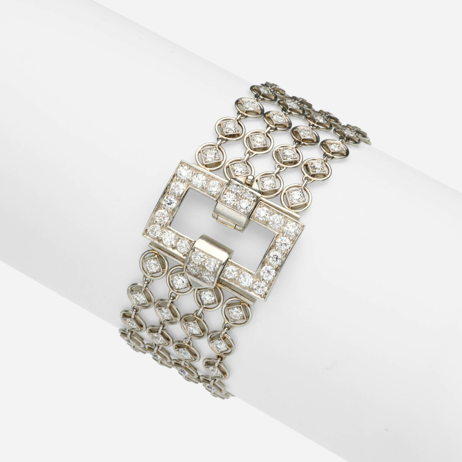 Art Deco, Diamond and platinum bracelet: Art Deco Diamond and platinum bracelet Set with old European-cut diamonds Platinum 6.375 x 0.875 in; Gross weight 19.0 dwts This work will ship from Lambertville, New Jersey.