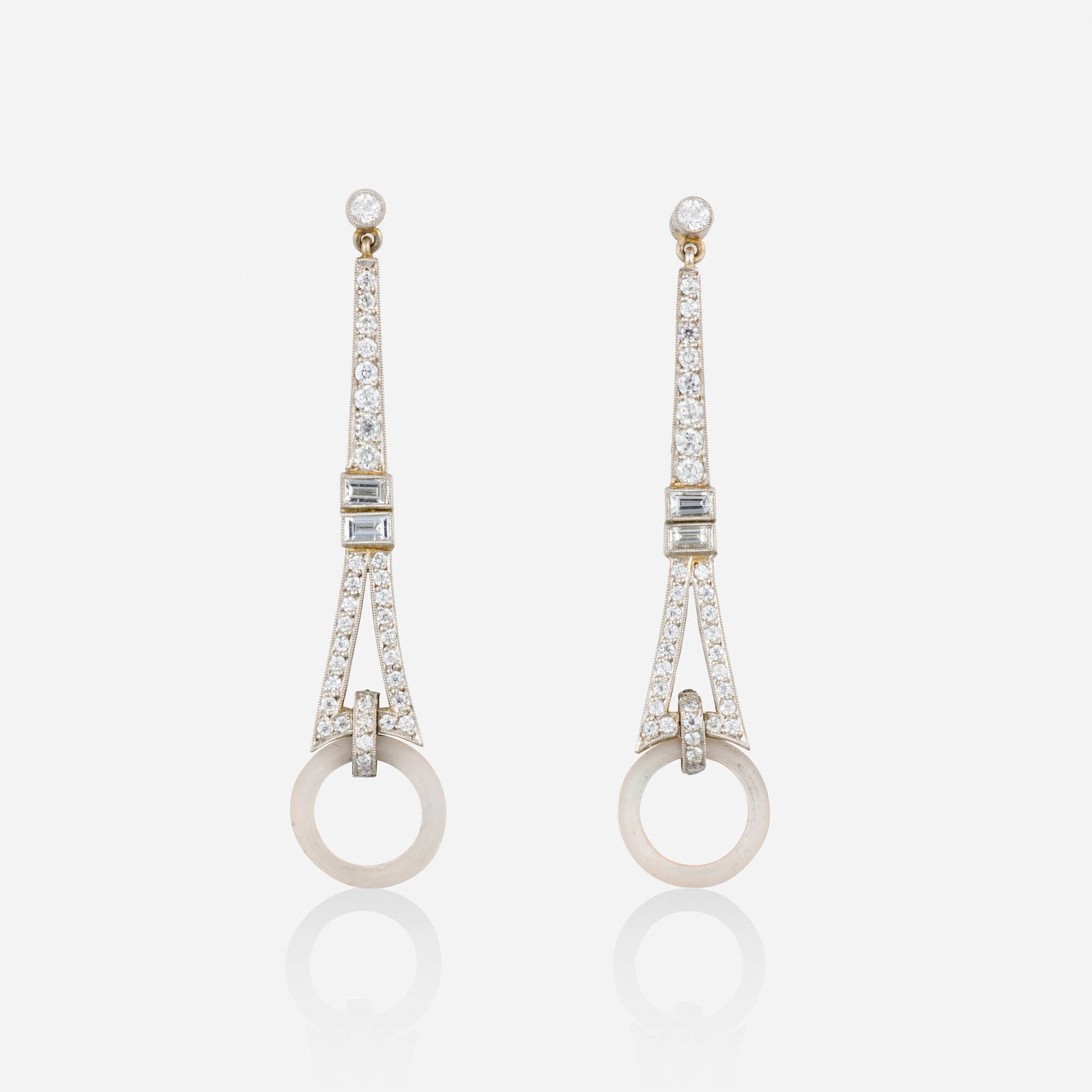 Art Deco, Diamond, rock crystal, and platinum earrings: Art Deco Diamond, rock crystal, and platinum earrings Each of geometric design, set with old European and baguette-cut diamonds, suspending a frosted rock crystal disc Platinum 2 x 0.375 in; Gross wei
