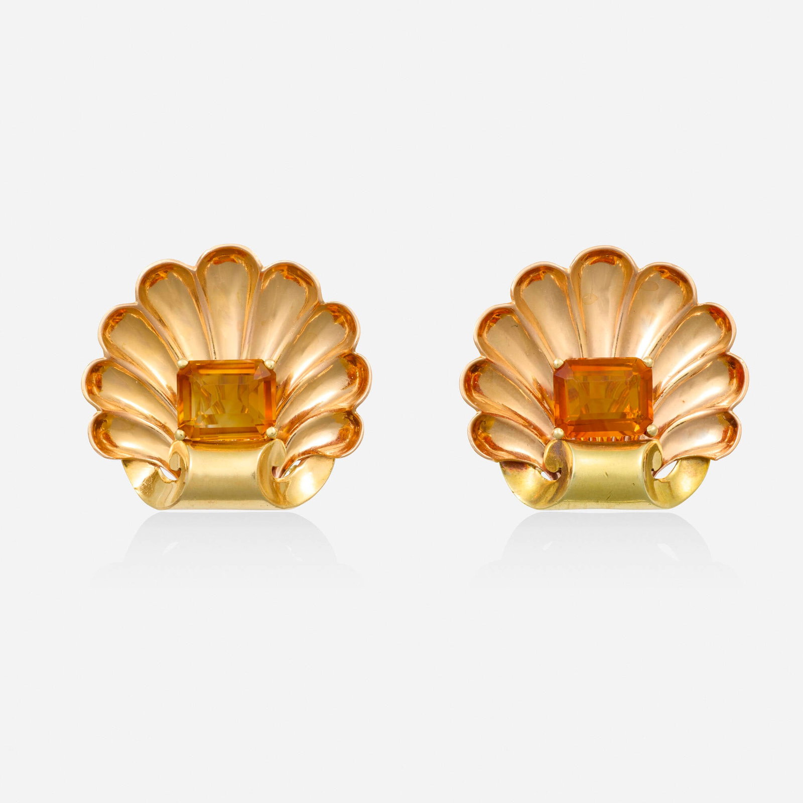 Retro, Citrine and bicolor gold earrings: Retro Citrine and bicolor gold earrings Each a scallop shell set with a rectangular-cut citrine Yellow and pink gold 1 x 1.125 in; Gross weight 9.3 dwts This work will ship from Lambertville, New Jers