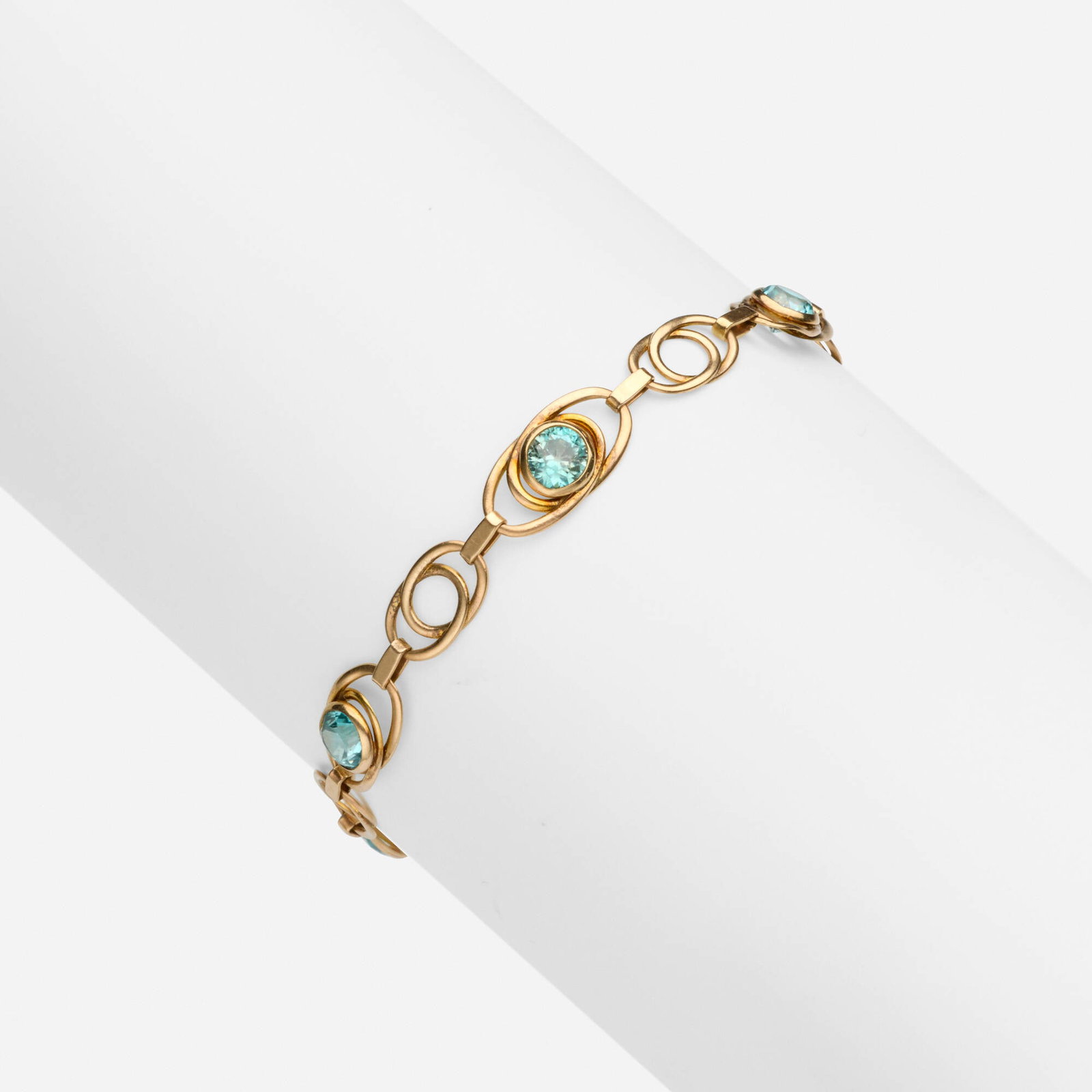Binder Bros Inc., Retro blue zircon and pink gold bracelet: Binder Bros Inc. Retro blue zircon and pink gold bracelet Of interlinked oval links, set with circular-cut blue zircons 10k pink gold Signed with maker's mark for Binder Bros. Inc 7.50 x 0.25