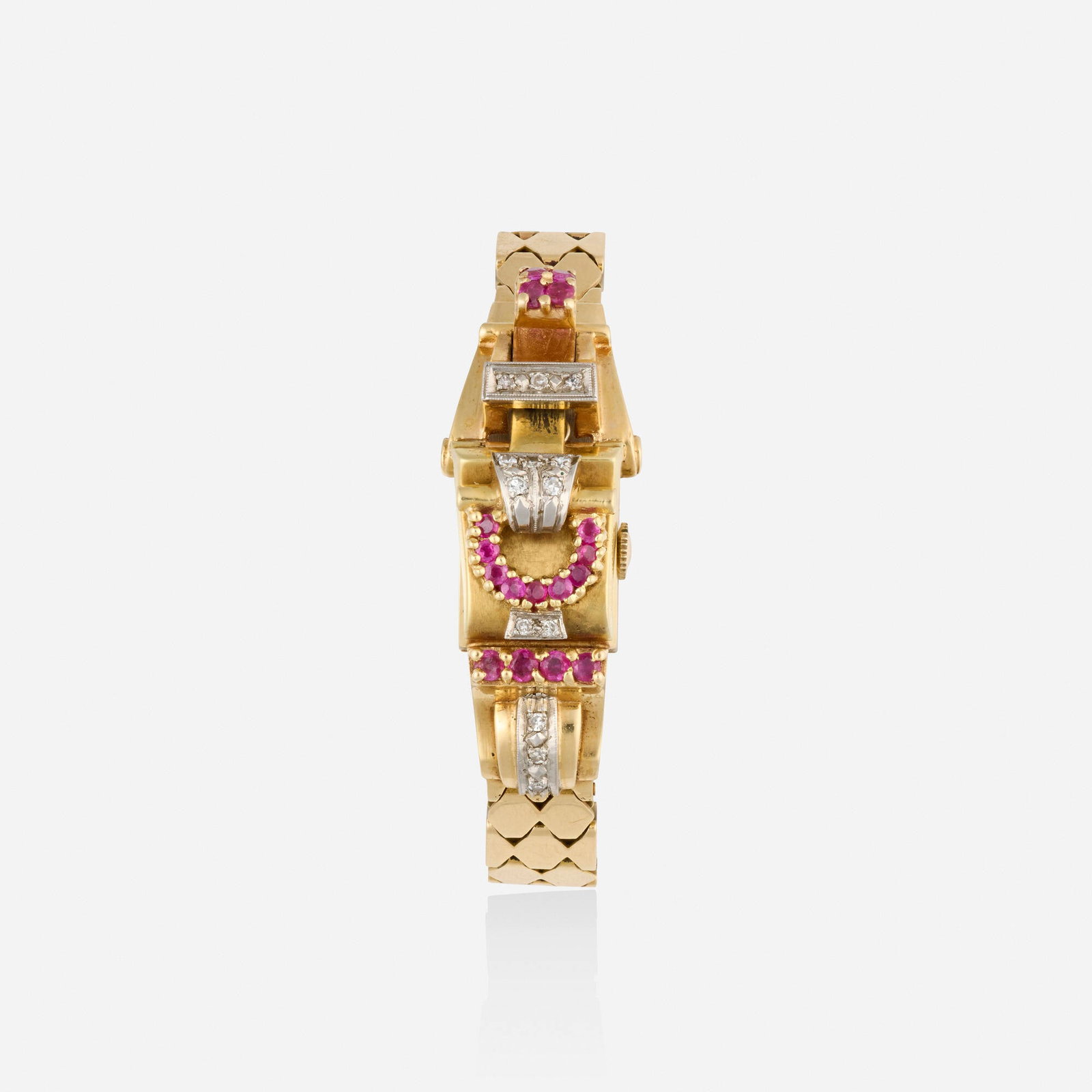 Retro, Ruby, diamond, and bicolor gold watch bracelet: Retro Ruby, diamond, and bicolor gold watch bracelet With Arabic hours, the cover case set with circular-cut rubies and single-cut diamonds, opens to a Champ watch dial Dial: Silvered Movement:
