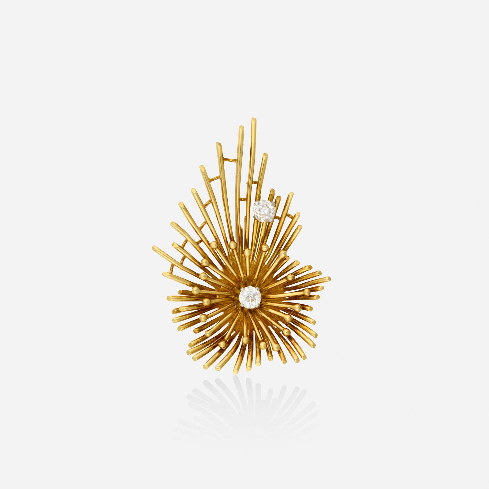 Kutchinsky, Retro diamond and gold pendant brooch: Kutchinsky Retro diamond and gold pendant brooch Of starburst design, set with old mine-cut diamonds Yellow gold Signed Kutchinsky 2.125 x 1.50 in; Gross weight 13.3 dwts This work will ship from