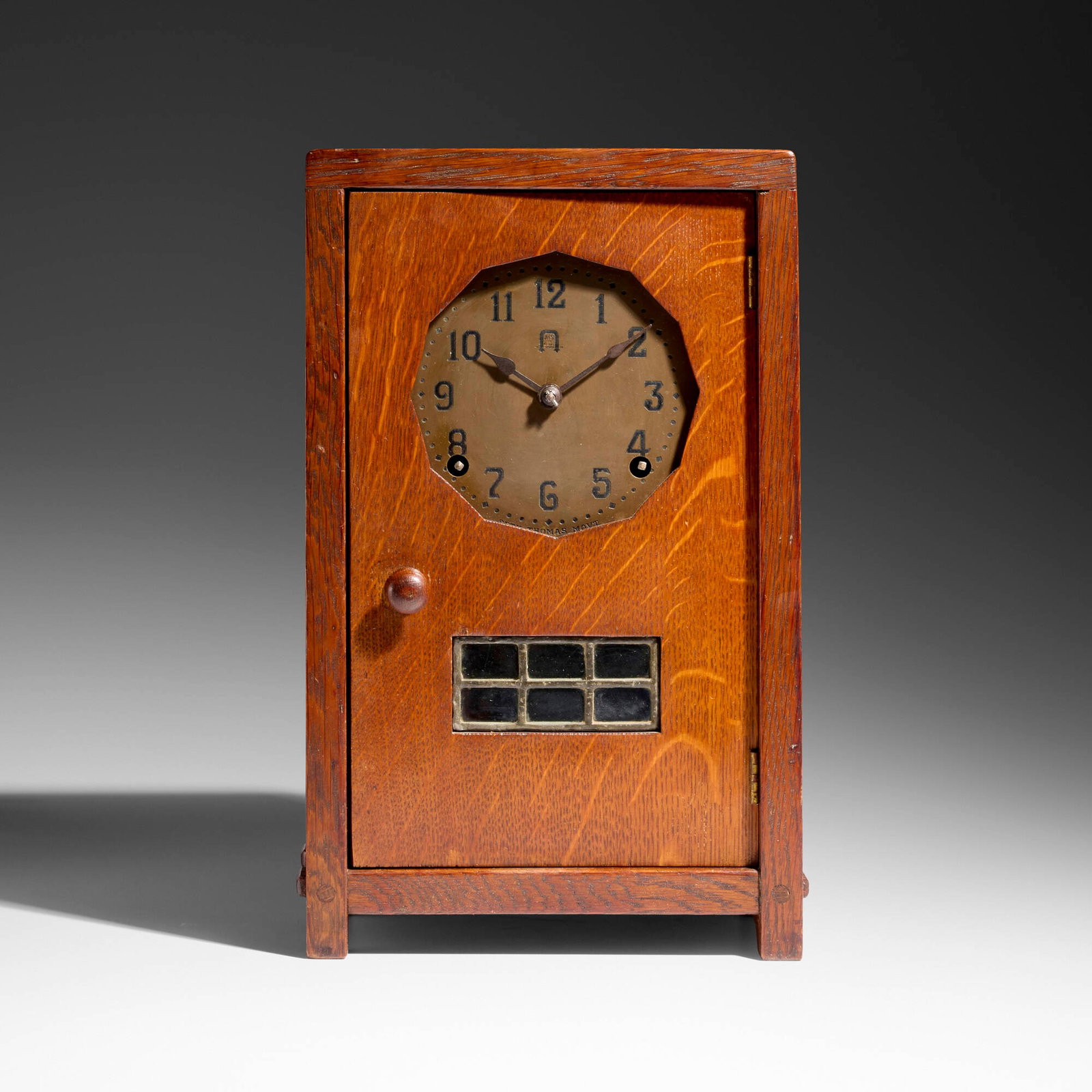 Gustav Stickley, Mantel clock: Gustav Stickley Mantel clock USA, c. 1912 oak, brass, leaded glass 13.75 h x 8.75 w x 5 d in (35 x 22 x 13 cm) Clock features a Seth Thomas movement. Impressed manufacturer's mark to reverse