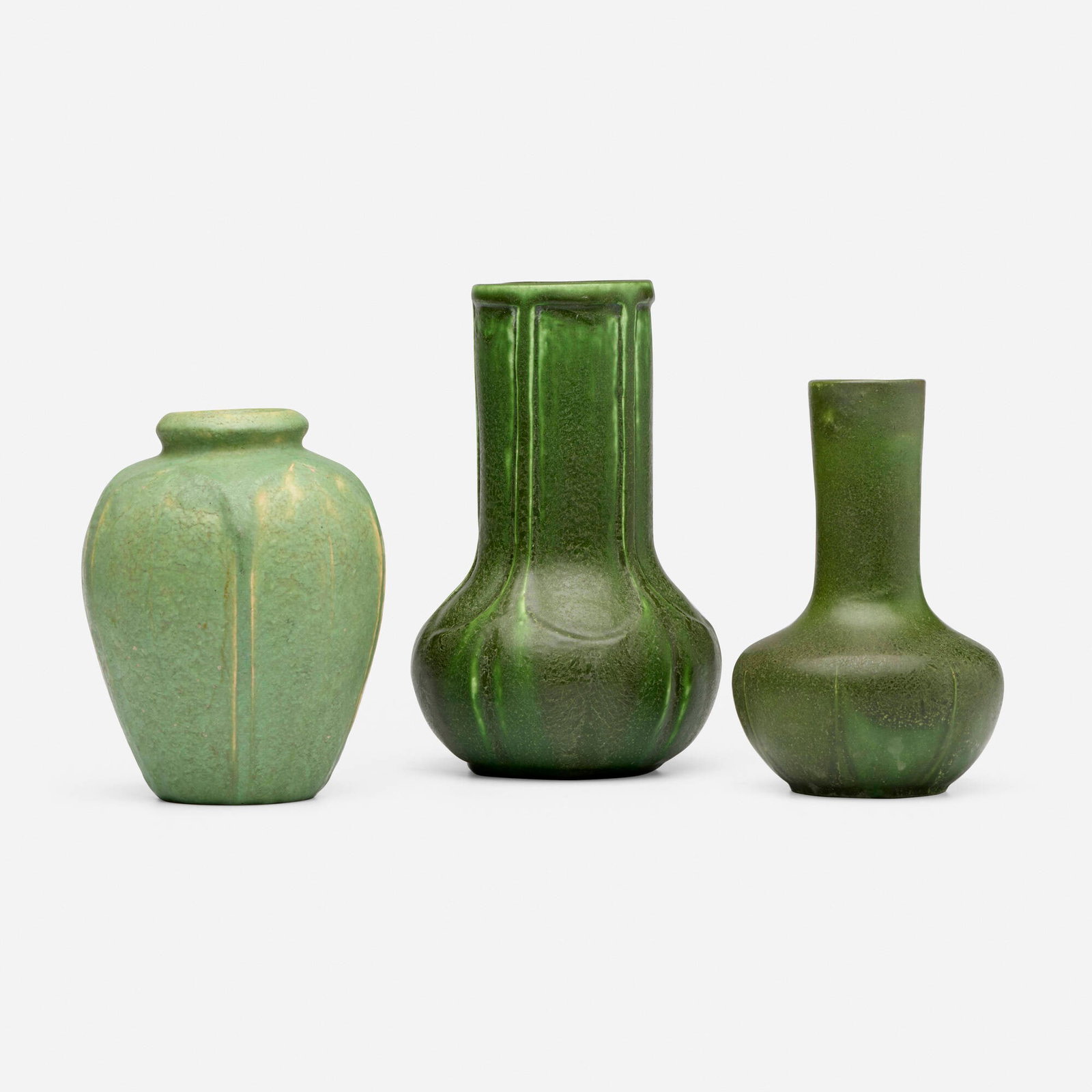 Grueby Faience Company, Collection of three vases with leaves: Grueby Faience Company Collection of three vases with leaves USA, 1899-1910 glazed earthenware 7 h x 4.5 dia in (18 x 11 cm) 5.75 h x 3.75 dia in (15 x 10 cm) 5.375 h x 4.25 dia in (14 x 11 cm)