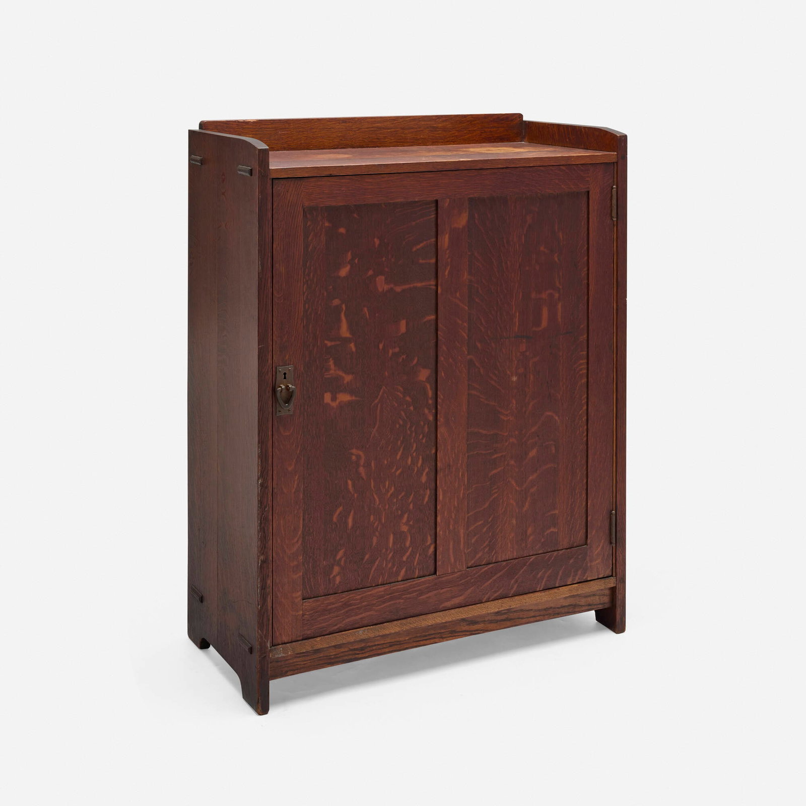 Gustav Stickley, Large music cabinet: Gustav Stickley Large music cabinet USA, c. 1907-1911 oak, iron 46.375 h x 34 w x 16 d in (118 x 86 x 41 cm) This unusual music cabinet is an uncatalogued, double-size form. Cabinet features one door