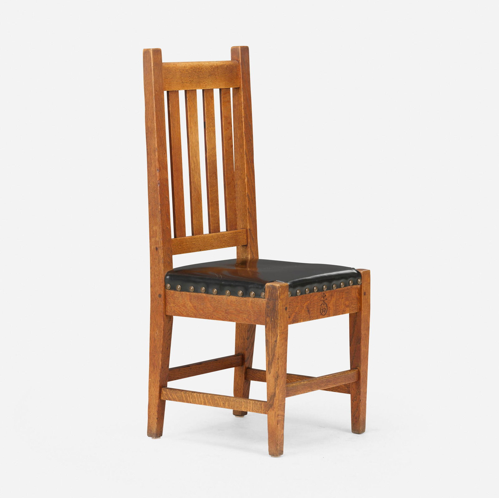 Roycroft, Chair, model 029: Roycroft Chair, model 029 USA, c. 1906 oak, hard black leather, tacks 41.25 h x 17 w x 17 d in (105 x 43 x 43 cm) Carved orb and cross mark to the front. Literature: A Catalog of Roycroft Furniture