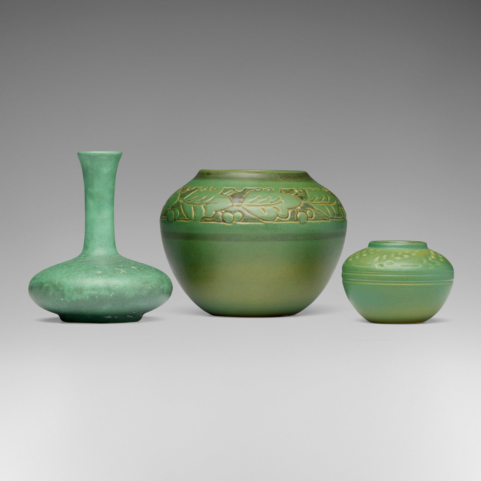 North Dakota School of Mines and Teco Pottery, Collection of three vases: North Dakota School of Mines and Teco Pottery Collection of three vases USA, first half of the 20th century glazed earthenware 5.75 h x 4.875 dia in (15 x 12 cm) 5.25 h x 6.5 dia in (13 x 17 cm) 2.75