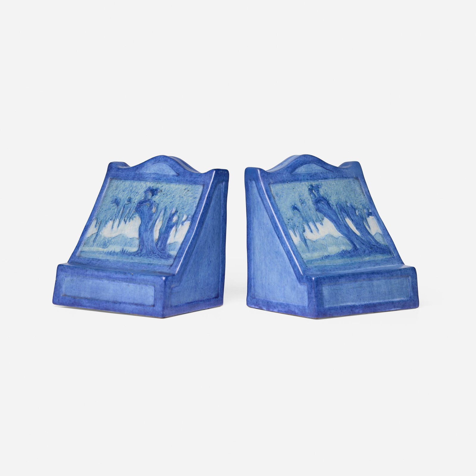 Newcomb College Pottery, Scenic bookends with live oaks and Spanish moss, pair: Newcomb College Pottery Scenic bookends with live oaks and Spanish moss, pair USA, 1929 glazed earthenware 5.75 h x 5.25 w x 4.25 d in (15 x 13 x 11 cm) 5.625 h x 5.125 w x 4.125 d in (14 x 13 x 10
