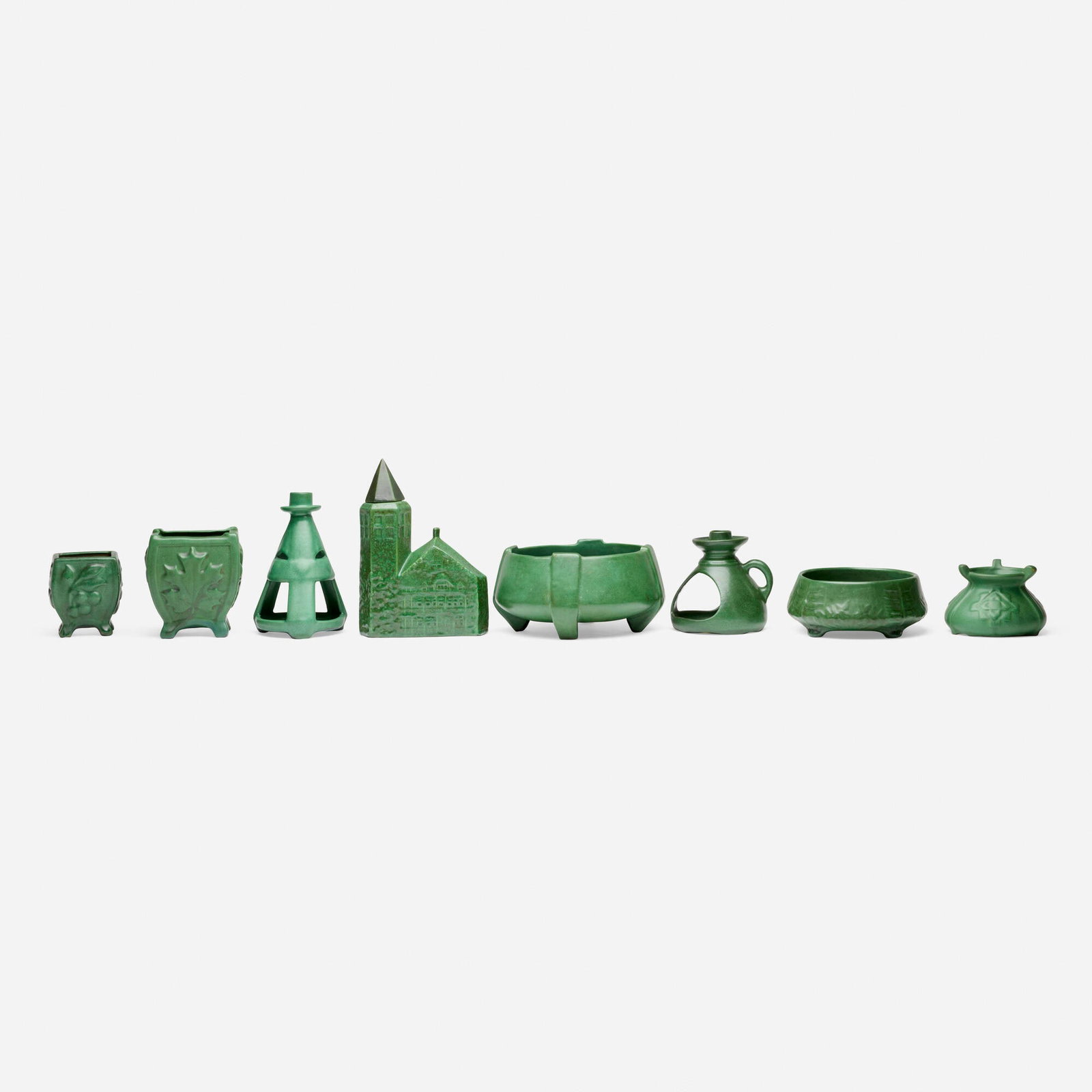 Weller Pottery, Collection of eight Bedford Matte works: Weller Pottery Collection of eight Bedford Matte works USA, c. 1910 glazed earthenware tallest: 9 h x 6.5 w x 2.5 d in (23 x 17 x 6 cm) shortest: 3 h x 7 dia in (8 x 18 cm) Lot comprises one church-sh