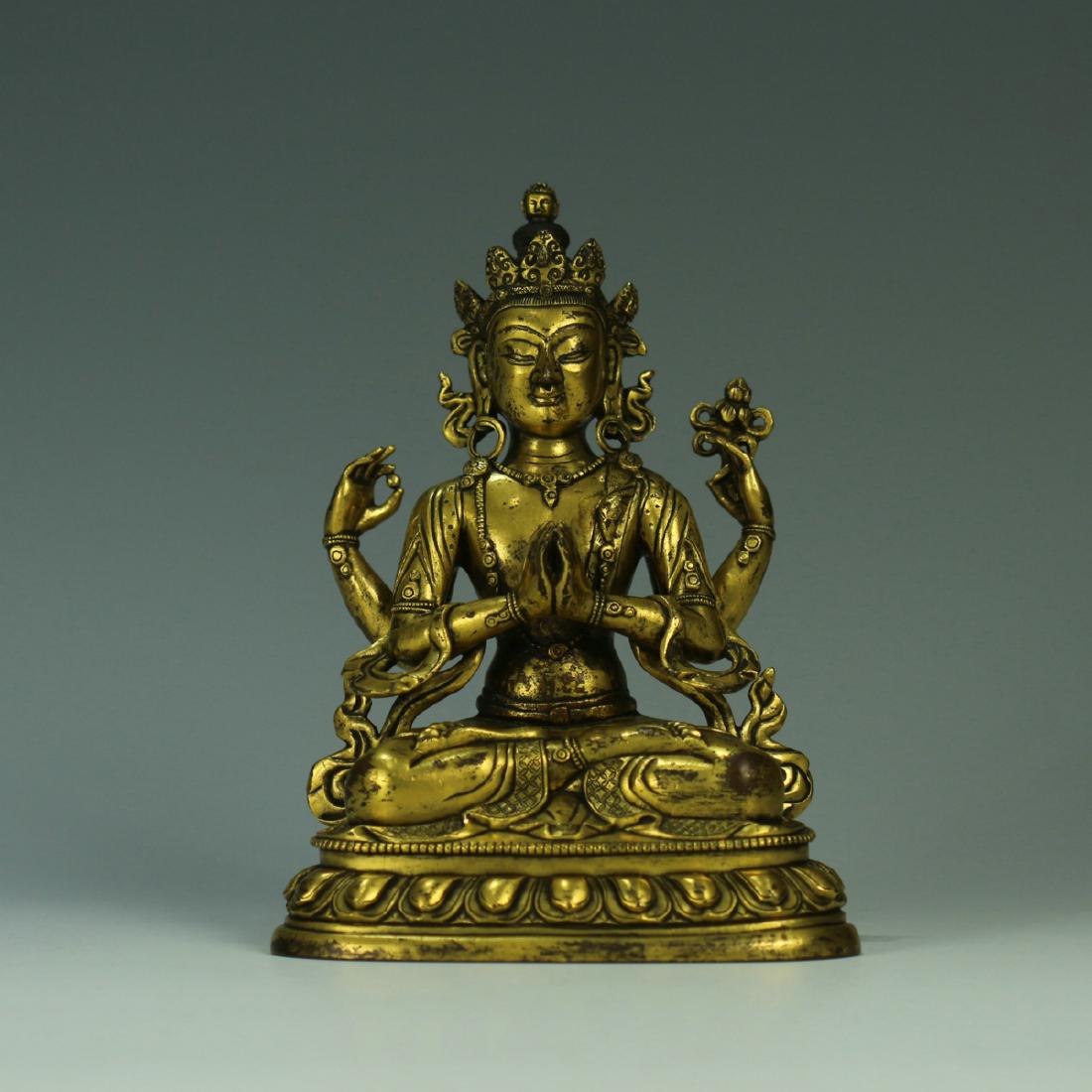 A gilt bronze figure of four-armed Guanyin (1 of 9)