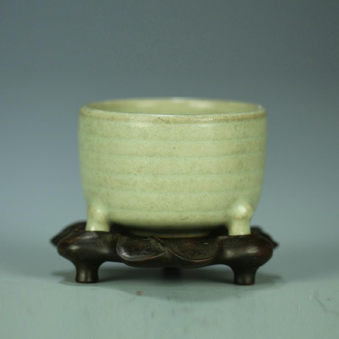 A celadon porcelain tripod jar with hardwood stand (1 of 8)