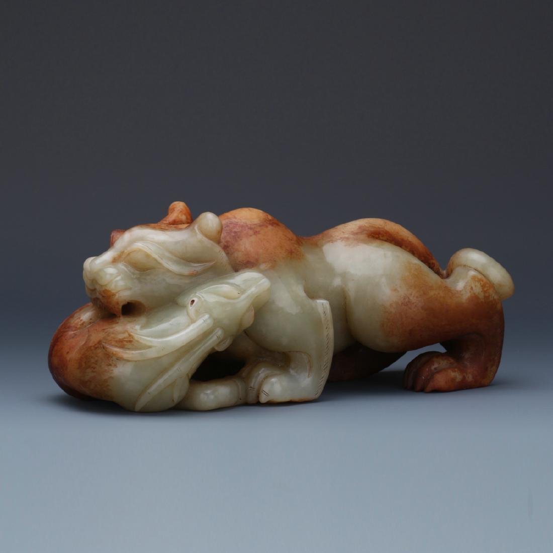 Archaic carved white jade beast figure (1 of 10)