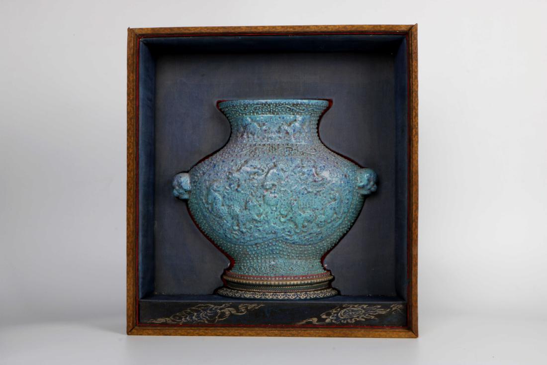 Lu Jun Glaze Curved Vase: In the form of a half-wall bottle, decorated on both sides of the shoulder with a bell ring, a hole in the back for hanging, the body of the jun glaze furnace. Slight ear injury. Deep blue glaze is me