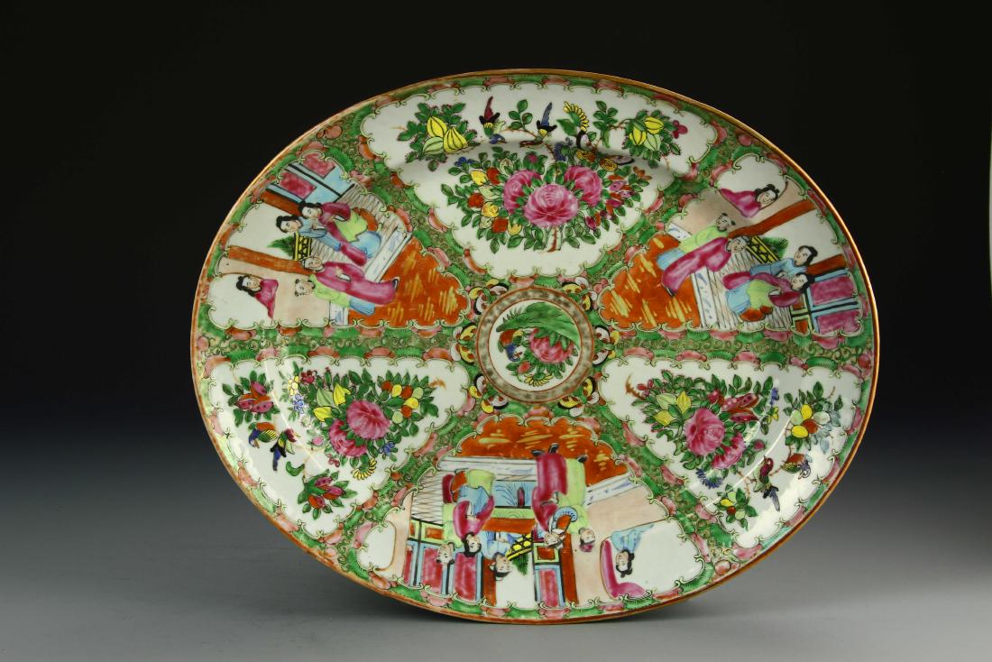 Chinese Rose Medallion Plate: China, 19th Century, Rose Medallion plate, shallow dish, painted quarters divided by a green floral border, scenes depicting robed figures together and flowers and fruit motifs. Diameter 16 in.