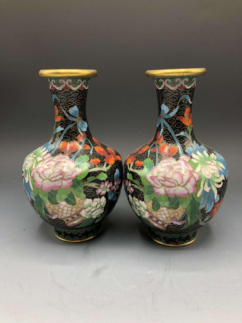 China, Cloisonne Enamel Vase: This is a couple of cloisonne enamel vase ,which has a round mouth,a short neck,a round belly and a round bottom. The outer wall of these vases are painted with colorful flower picture, which are beau