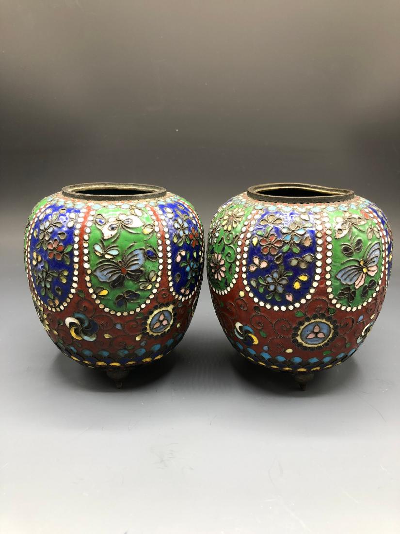 China, Cloisonne Enamel Vase: This is a couple of cloisonne enamel vase ,which has a round mouth,a short neck,a round belly and a round bottom. The outer wall of these vases are painted with colorful flower picture, which are beau