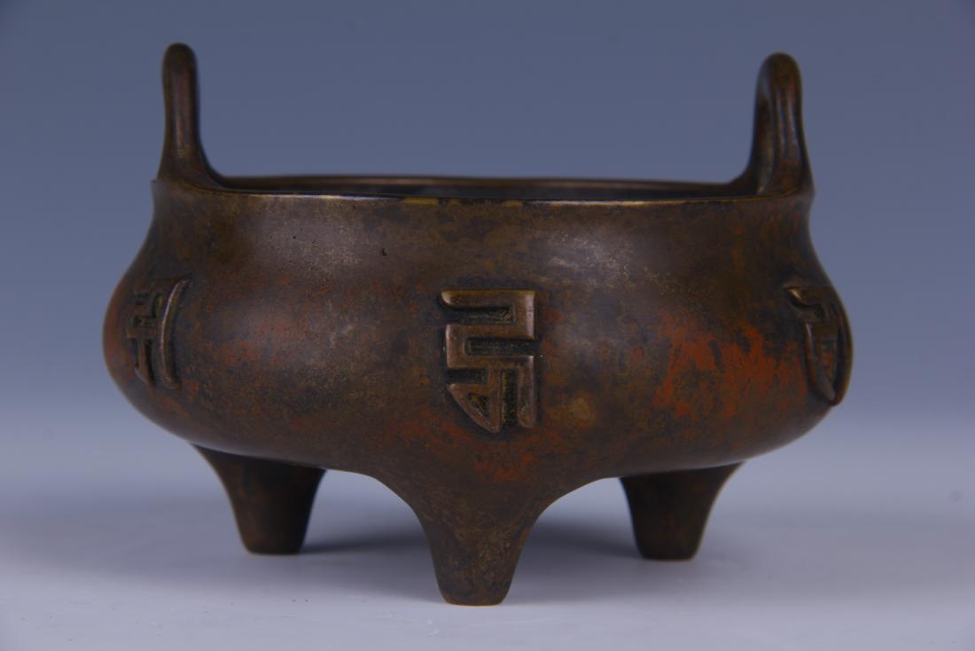 CHINESE BRONZE BINAURAL TRIPOD CENSER: Dimensions: H.8 cm. W.11.5 cm. Weight.954 g