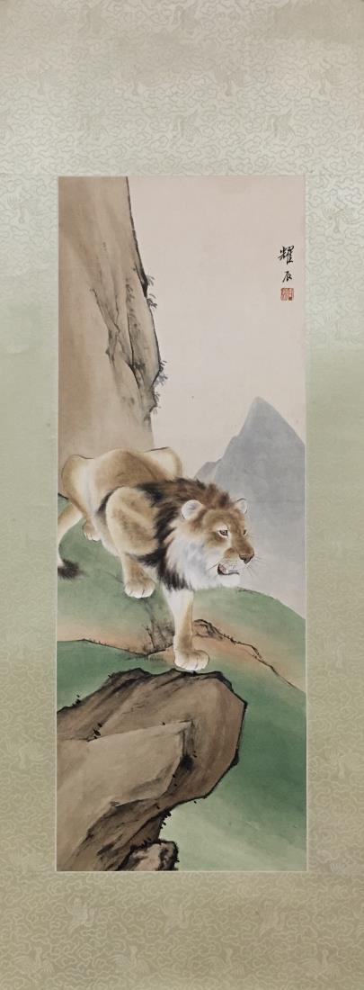 A PAINTING OF LION ON MOUNTAIN, LIU KUILING: A painting of lion on mountain by Liu Kuiling. Ink and color on paper, Mounted. Artist signature and seal. Dimensions: Inner Painting: 62 cm x 22 cm. All measurements are approximate.