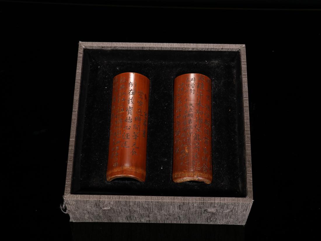 A PAIR OF 'INSCRIPTIONS' BAMBOO CARVING BRUSH POTS: A pair of 'inscriptions' bamboo carving brush pots. Dimensions: Each one: H 12.8 cm, Diam 4.5 cm, Weight 58.8 g. All measurements are approximate.