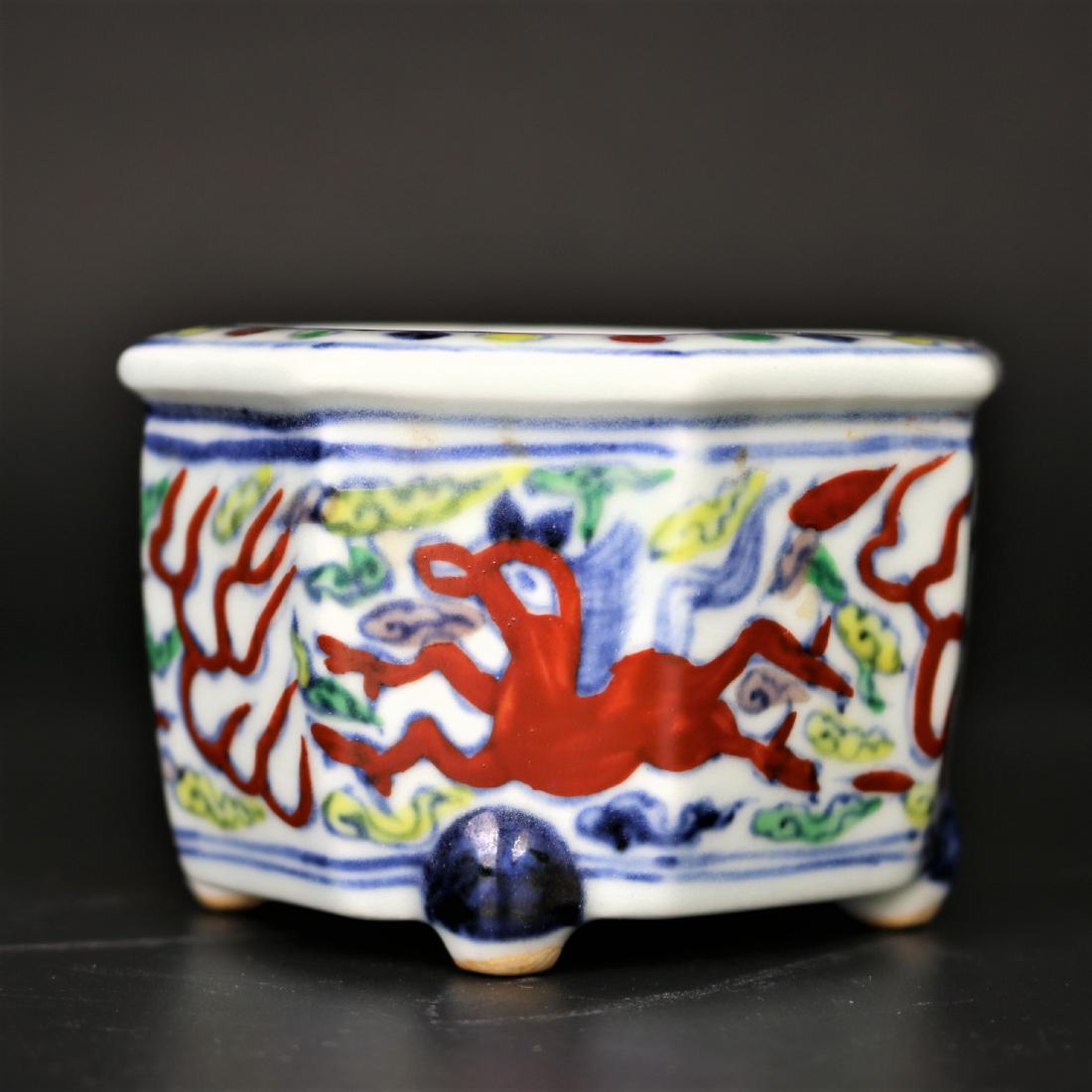 A Chinese Doucai Pen Washer,: A Chinese Doucai pen washer with Ming dynasty Jia Jing Mark on the base. Height: 2 3/8 inches Width: 3 1/2 inches.