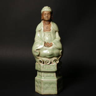 A Chinese Celadon Glazed Porcelain Buddha,Ming dynasty: A Chinese celadon-glazed porcelain Buddha figure.Ming dynasty. Height: 7 3/4 inches.Reference: Sotheby's London, 14th May 2008, lot 332.