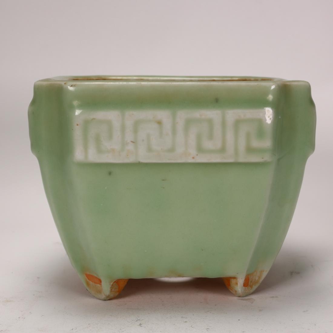 A Chinese Antique Celadon-Glazed Porcelain Pot: A Chinese antique celadon glazed porcelain pot.