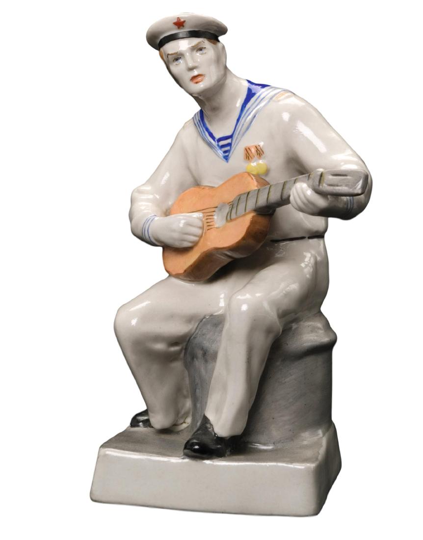 Russian Porcelain Figure of Sailor playing a guitar