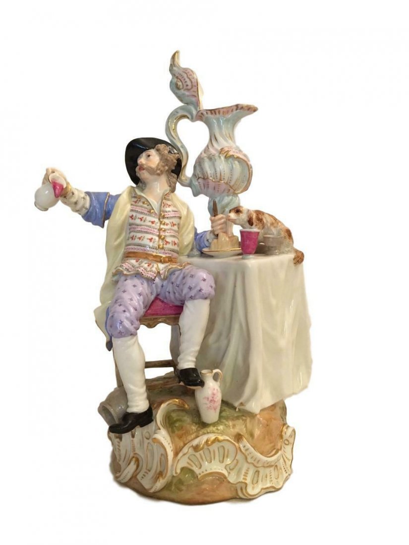 ANTIQUE MEISSEN FIGURE OF A MAN DINING: A MEISSEN FIGURE OF A MAN DINING CIRCA 1870, BLUE CROSSED SWORDS MARK, PRESSNUMMER 72 Modelled holding a jug of wine in his right hand and with further empty jugs at his feet, a mischievous hound rest