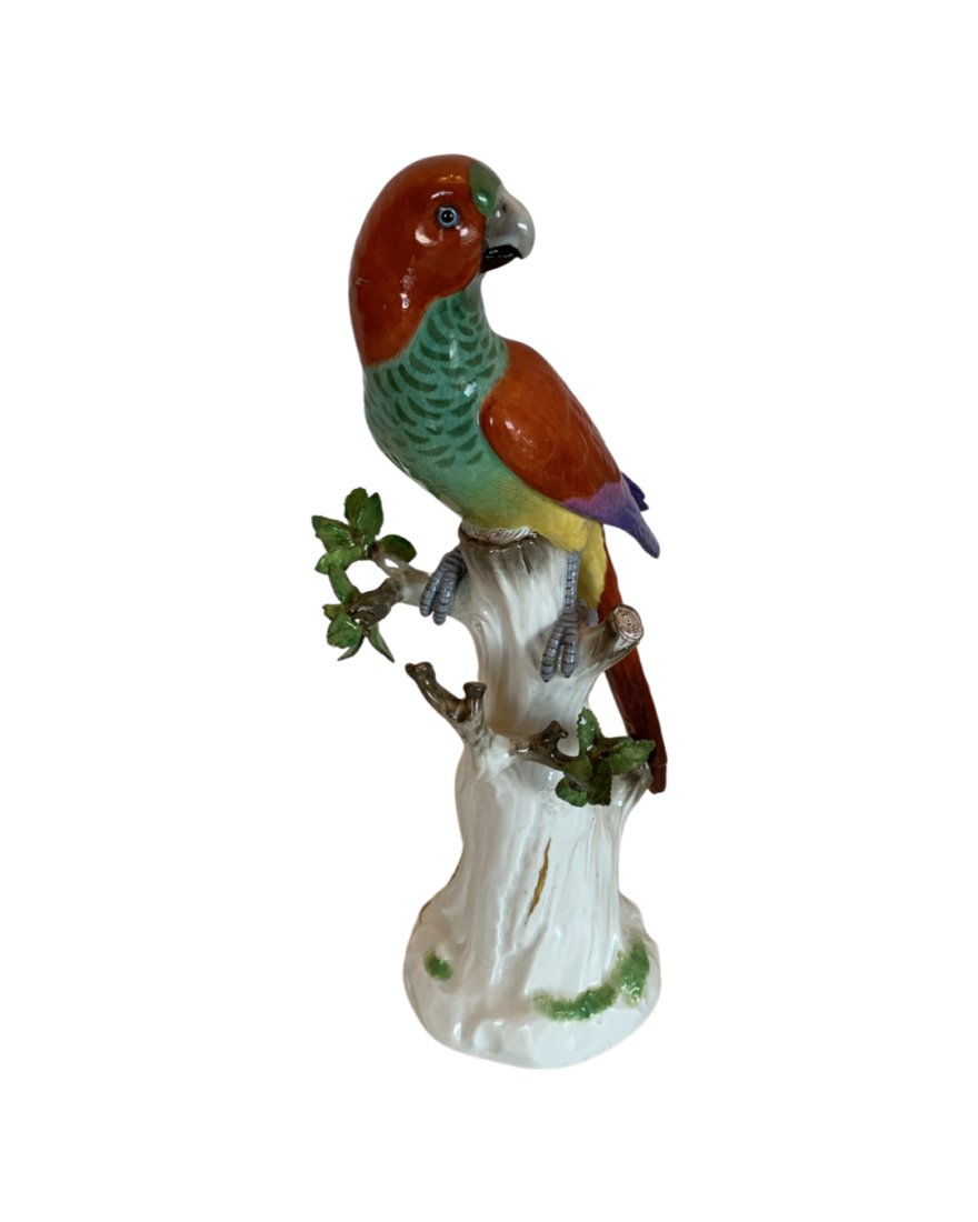 Antique Meissen porcelain parrot: A MEISSEN MODEL OF A PARROT Late 19TH CENTURY, BLUE CROSSED SWORDS MARKS, INCISED 20., PRESSNUMMER 93 Naturalistically modelled with brightly coloured plumage, perched on a tree stump 12 in. (30.5 cm.