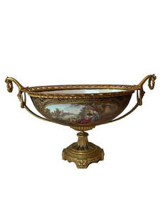 Antique Sevres Porcelain Bronze Centerpiece: AN ORMOLU-MOUNTED SEVRES COBALT-BLUE GROUND CENTERPIECE LATE 19TH CENTURY, INTERLACED L'S MARK THE PIERCED SCROLLWORK GALLERY FLANKED BY UPRIGHT SCROLLING BULRUSH HANDLES, SIGNEDTHE FRONT PAINTED