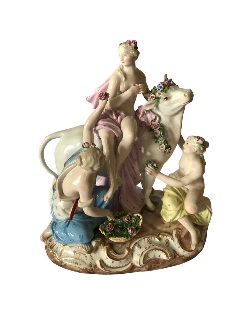 Antique Meissen Porcelain Group of Europa and the Bull: A MEISSEN GROUP OF EUROPA AND THE BULLCIRCA 1880, BLUE CROSSED SWORDS MARK (INCISED LINE UNDERNEATH), INCISED 2697, PRESSNUMMER 146Europa wearing a loose drape, seated on the garlanded bull, on a shap