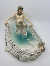 A MEISSEN FIGURE GROUP OF A NYMPH BEING CAPTURED, 'TRITONENFANG'