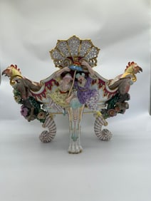 A large Meissen figural quadrupod shaped lemon basket